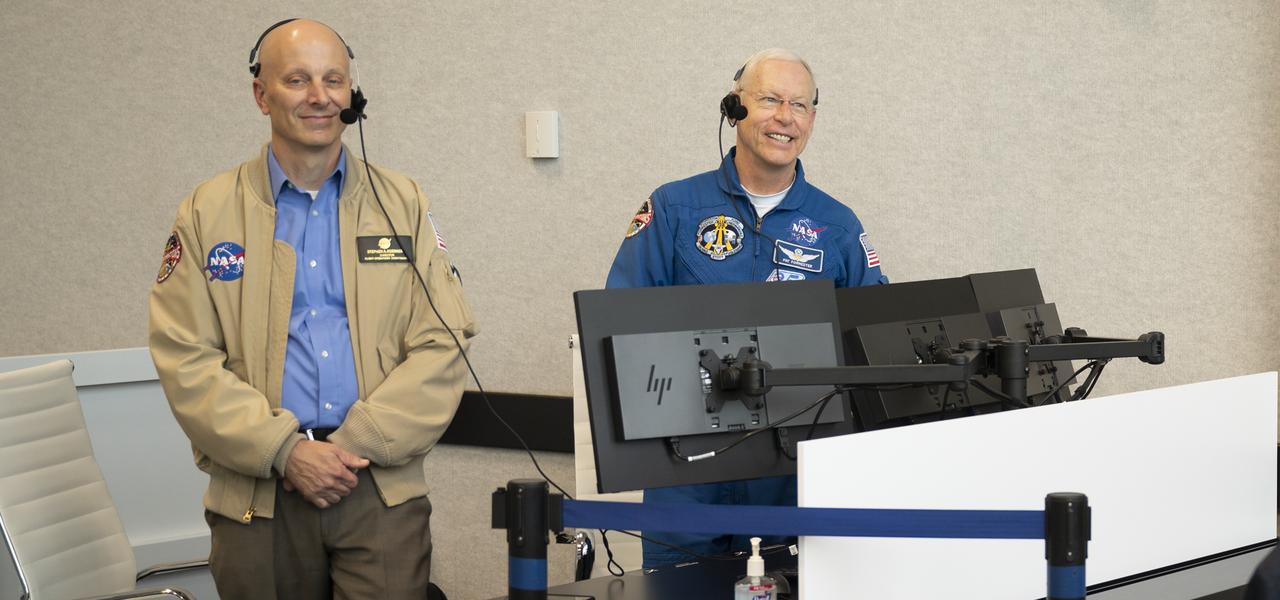 Stephen Koerner, Director of the Flight Operations Directorate at NASA’s Johnson Space Center, left, and Pat Forrester, NASA’s chief of the astronaut office, monitor the launch of a SpaceX Falcon 9 rocket carrying the company's Crew Dragon spacecraft on the Demo-2 mission with NASA astronauts Douglas Hurley and Robert Behnken onboard, Saturday, May 30, 2020, in  firing room four of the Launch Control Center at NASA’s Kennedy Space Center in Florida. NASA’s SpaceX Demo-2 mission is the first launch with astronauts of the SpaceX Crew Dragon spacecraft and Falcon 9 rocket to the International Space Station as part of the agency’s Commercial Crew Program. The test flight serves as an end-to-end demonstration of SpaceX’s crew transportation system. Behnken and Hurley launched at 3:22 p.m. EDT on Saturday, May 30, from Launch Complex 39A at the Kennedy Space Center. A new era of human spaceflight is set to begin as American astronauts once again launch on an American rocket from American soil to low-Earth orbit for the first time since the conclusion of the Space Shuttle Program in 2011. Photo Credit: (NASA/Joel Kowsky)