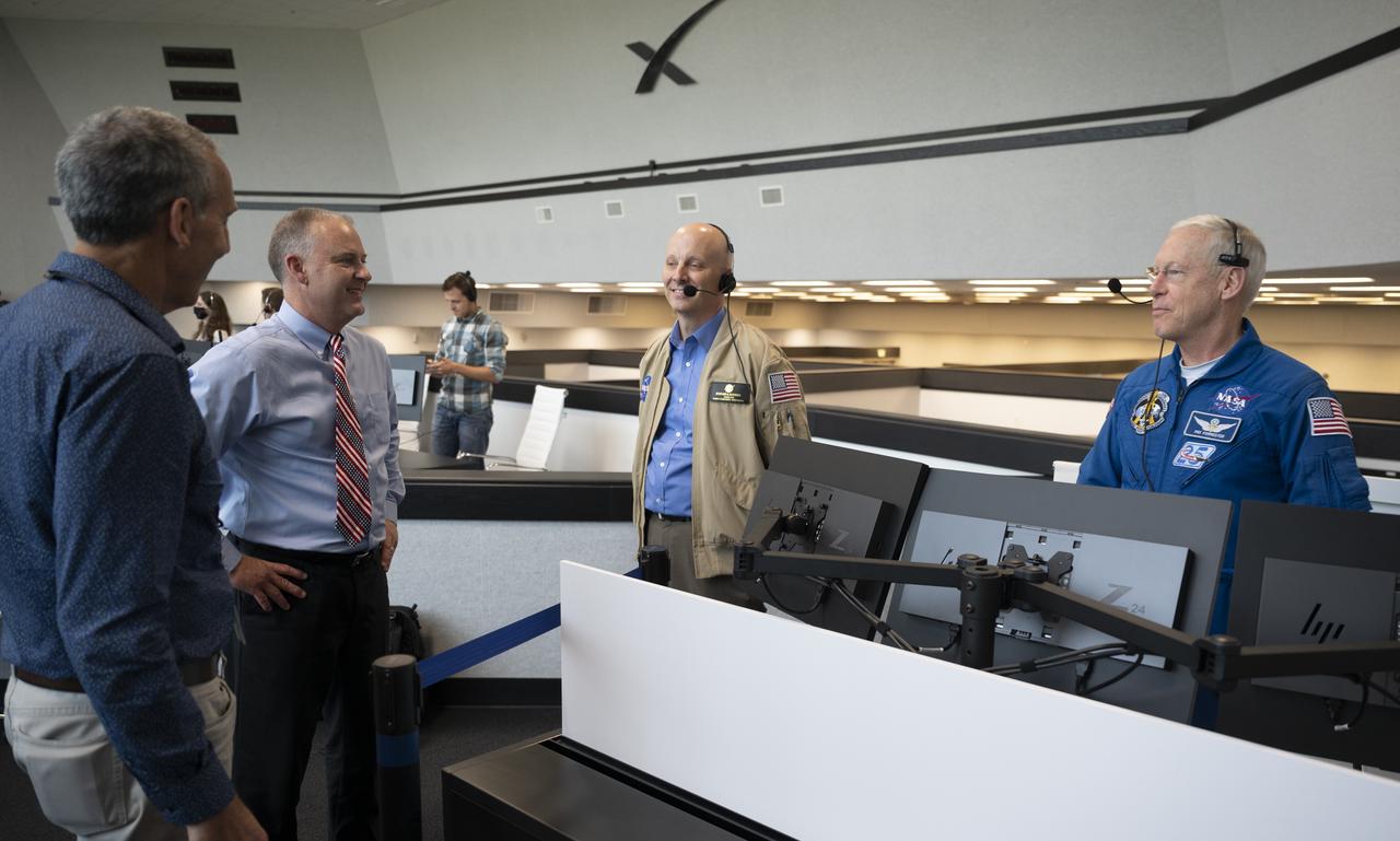 Lee Rosen, vice president for mission and launch operations at SpaceX, left, Norm Knight, deputy director of Flight Operations at NASA's Johnson Space Center, Stephen Koerner, Director of the Flight Operations Directorate at NASA’s Johnson Space Center, and Pat Forrester, NASA’s chief of the astronaut office, are seen after the launch of a SpaceX Falcon 9 rocket carrying the company's Crew Dragon spacecraft on the Demo-2 mission with NASA astronauts Douglas Hurley and Robert Behnken onboard, Saturday, May 30, 2020, in  firing room four of the Launch Control Center at NASA’s Kennedy Space Center in Florida. NASA’s SpaceX Demo-2 mission is the first launch with astronauts of the SpaceX Crew Dragon spacecraft and Falcon 9 rocket to the International Space Station as part of the agency’s Commercial Crew Program. The test flight serves as an end-to-end demonstration of SpaceX’s crew transportation system. Behnken and Hurley launched at 3:22 p.m. EDT on Saturday, May 30, from Launch Complex 39A at the Kennedy Space Center. A new era of human spaceflight is set to begin as American astronauts once again launch on an American rocket from American soil to low-Earth orbit for the first time since the conclusion of the Space Shuttle Program in 2011. Photo Credit: (NASA/Joel Kowsky)