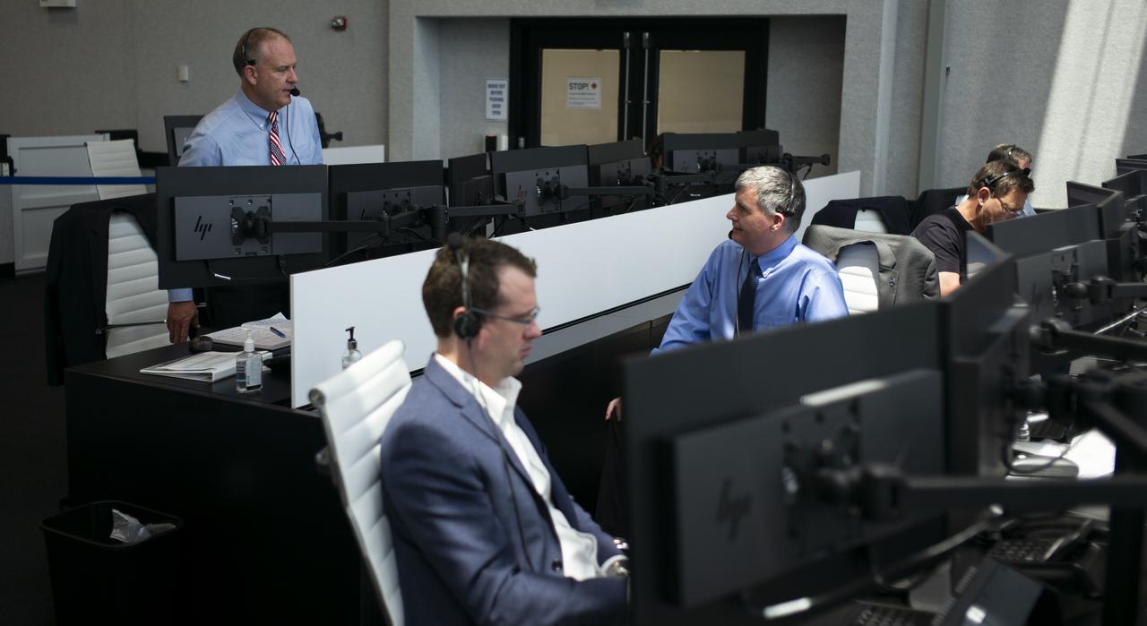 Norm Knight, deputy director of Flight Operations at NASA's Johnson Space Center, left, and Steve Stich, deputy manager of NASA’s Commercial Crew Program, are seen as they monitor the countdown of the launch of a SpaceX Falcon 9 rocket carrying the company's Crew Dragon spacecraft on NASA’s SpaceX Demo-2 mission with NASA astronauts Robert Behnken and Douglas Hurley onboard, Saturday, May 30, 2020, in firing room four of the Launch Control Center at NASA’s Kennedy Space Center in Florida. NASA’s SpaceX Demo-2 mission is the first launch with astronauts of the SpaceX Crew Dragon spacecraft and Falcon 9 rocket to the International Space Station as part of the agency’s Commercial Crew Program. The test flight serves as an end-to-end demonstration of SpaceX’s crew transportation system. Behnken and Hurley launched at 3:22 p.m. EDT on Saturday, May 30, from Launch Complex 39A at the Kennedy Space Center. A new era of human spaceflight is set to begin as American astronauts once again launch on an American rocket from American soil to low-Earth orbit for the first time since the conclusion of the Space Shuttle Program in 2011. Photo Credit: (NASA/Joel Kowsky)