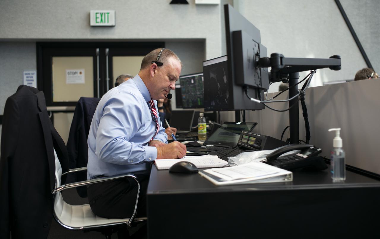 Norm Knight, deputy director of Flight Operations at NASA's Johnson Space Center is seen durring the countdown of the launch of a SpaceX Falcon 9 rocket carrying the company's Crew Dragon spacecraft on NASA’s SpaceX Demo-2 mission with NASA astronauts Robert Behnken and Douglas Hurley onboard, Saturday, May 30, 2020, in firing room four of the Launch Control Center at NASA’s Kennedy Space Center in Florida. NASA’s SpaceX Demo-2 mission is the first launch with astronauts of the SpaceX Crew Dragon spacecraft and Falcon 9 rocket to the International Space Station as part of the agency’s Commercial Crew Program. The test flight serves as an end-to-end demonstration of SpaceX’s crew transportation system. Behnken and Hurley launched at 3:22 p.m. EDT on Saturday, May 30, from Launch Complex 39A at the Kennedy Space Center. A new era of human spaceflight is set to begin as American astronauts once again launch on an American rocket from American soil to low-Earth orbit for the first time since the conclusion of the Space Shuttle Program in 2011. Photo Credit: (NASA/Joel Kowsky)