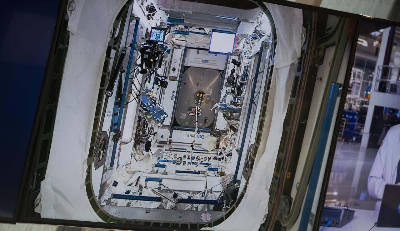 A view inside Node 2 of the International Space Station showing the hatch leading to PMA 2 is seen on a monitor inside firing room four following the docking of SpaceX’s Crew Dragon spacecraft with NASA astronauts Douglas Hurley and Robert Behnken onboard to the International Space Station, Sunday, May 31, 2020, in the Launch Control Center at NASA’s Kennedy Space Center in Florida. NASA’s SpaceX Demo-2 mission is the first launch with astronauts of the SpaceX Crew Dragon spacecraft and Falcon 9 rocket to the International Space Station as part of the agency’s Commercial Crew Program. The test flight serves as an end-to-end demonstration of SpaceX’s crew transportation system. Behnken and Hurley launched at 3:22 p.m. EDT on Saturday, May 30, from Launch Complex 39A at the Kennedy Space Center and docked with the International Space Station at 10:16am EDT on Sunday, May 31.. A new era of human spaceflight is set to begin as American astronauts once again launch on an American rocket from American soil to low-Earth orbit for the first time since the conclusion of the Space Shuttle Program in 2011. Photo Credit: (NASA/Joel Kowsky)