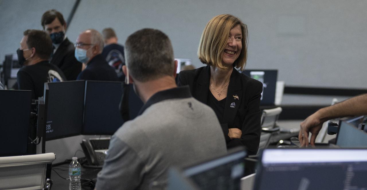 Kathy Lueders, manager of NASA's Commercial Crew Program, is seen following the docking of SpaceX’s Crew Dragon spacecraft with NASA astronauts Douglas Hurley and Robert Behnken onboard to the International Space Station, Sunday, May 31, 2020, in firing room four of the Launch Control Center at NASA’s Kennedy Space Center in Florida. NASA’s SpaceX Demo-2 mission is the first launch with astronauts of the SpaceX Crew Dragon spacecraft and Falcon 9 rocket to the International Space Station as part of the agency’s Commercial Crew Program. The test flight serves as an end-to-end demonstration of SpaceX’s crew transportation system. Behnken and Hurley launched at 3:22 p.m. EDT on Saturday, May 30, from Launch Complex 39A at the Kennedy Space Center and docked with the International Space Station at 10:16am EDT on Sunday, May 31. A new era of human spaceflight is set to begin as American astronauts once again launch on an American rocket from American soil to low-Earth orbit for the first time since the conclusion of the Space Shuttle Program in 2011. Photo Credit: (NASA/Joel Kowsky)