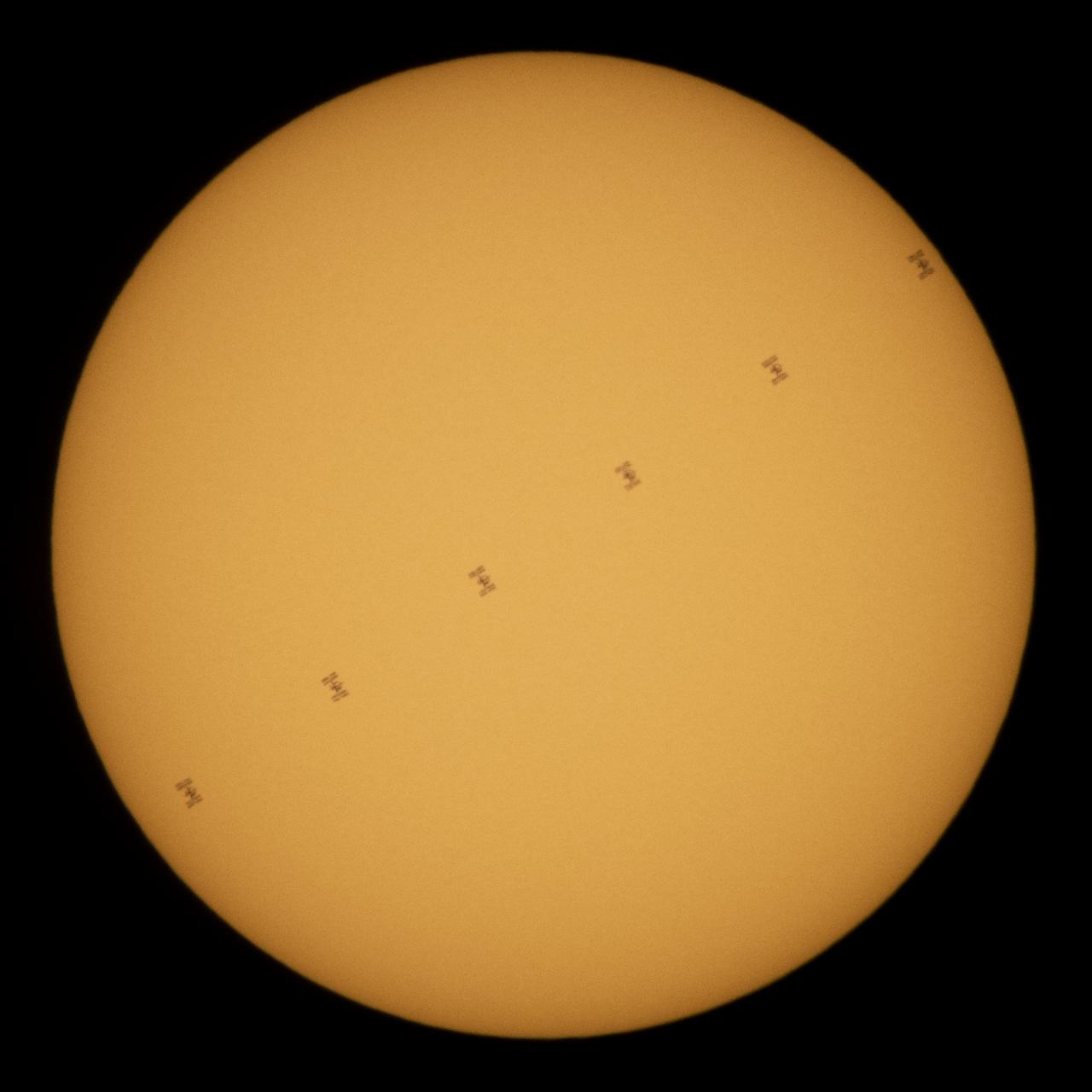 This composite image, made from six frames, shows the International Space Station, with a crew of five onboard, in silhouette as it transits the Sun at roughly five miles per second, Wednesday, June 24, 2020, from Fredericksburg, Va. Onboard are Expedition 63 NASA astronauts Chris Cassidy, Douglas Hurley, Robert Behnken, and Roscosmos cosmonauts Anatoly Ivanishin and Ivan Vagner. Photo Credit: (NASA/Joel Kowsky)