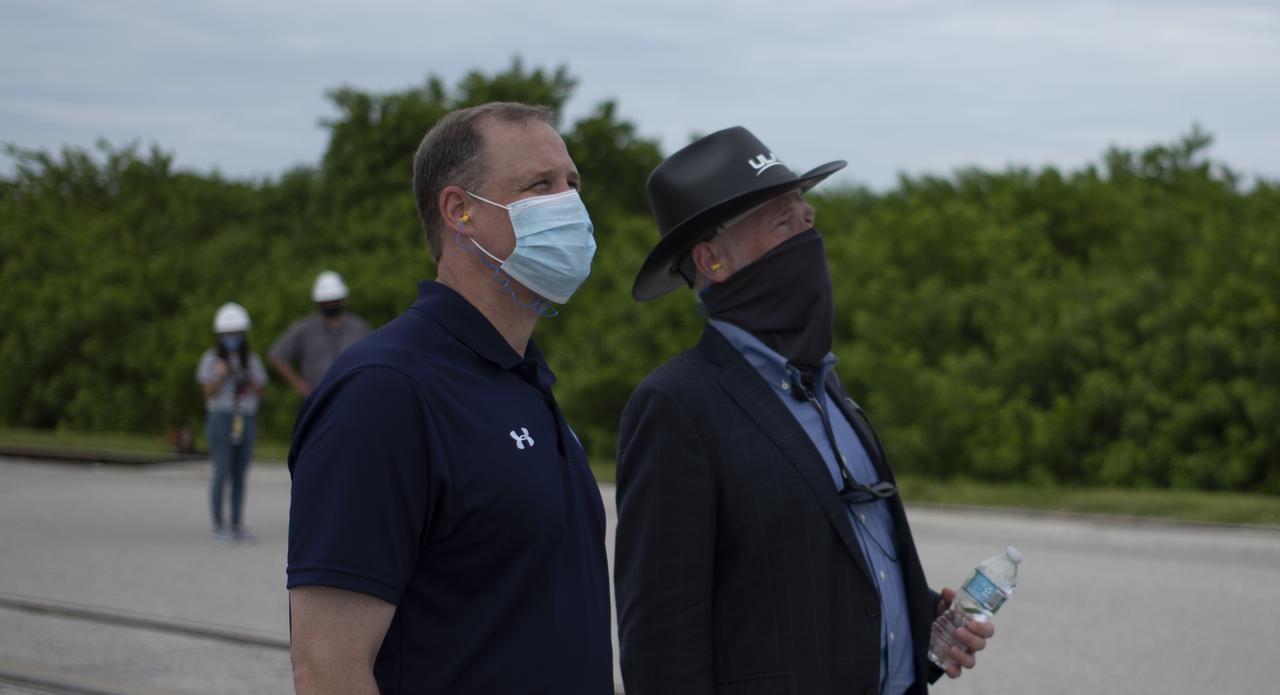 NASA Administrator Jim Bridenstine, left, and Tory Bruno, president and CEO of United Launch Alliance, are seen as they watch a United Launch Alliance Atlas V rocket with NASA’s Mars 2020 Perseverance rover onboard as it is rolled out of the Vertical Integration Facility to the launch pad at Space Launch Complex 41, Tuesday, July 28, 2020, at Cape Canaveral Air Force Station in Florida. The Perseverance rover is part of NASA’s Mars Exploration Program, a long-term effort of robotic exploration of the Red Planet. Launch is scheduled for Thursday, July 30. Photo Credit: (NASA/Joel Kowsky)