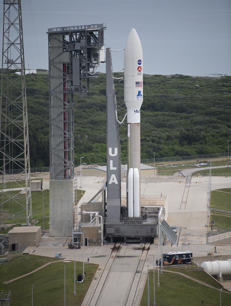 A United Launch Alliance Atlas V rocket with NASA’s Mars 2020 Perseverance rover onboard is seen on the launch pad at Space Launch Complex 41, Wednesday, July 29, 2020, at Cape Canaveral Air Force Station in Florida. The Perseverance rover is part of NASA’s Mars Exploration Program, a long-term effort of robotic exploration of the Red Planet. Launch is scheduled for Thursday, July 30.  Photo Credit: (NASA/Joel Kowsky)