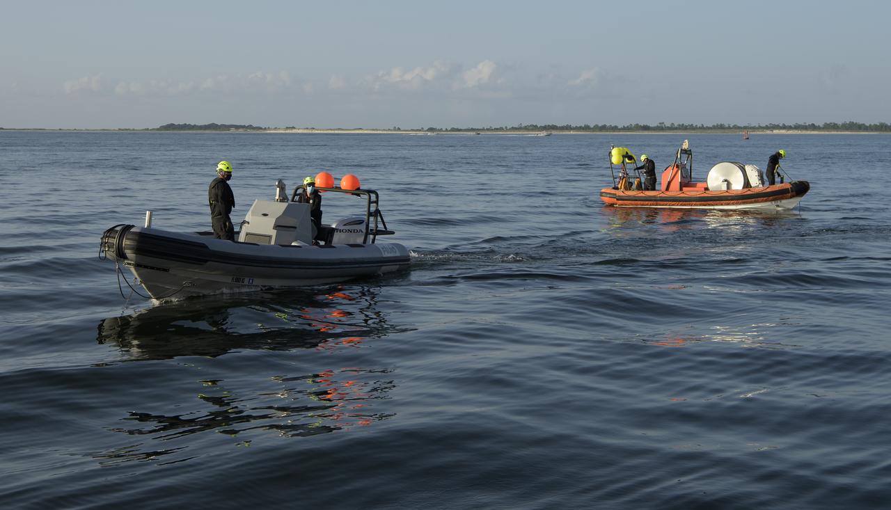 SpaceX support teams are deployed on fast boats from the SpaceX GO Navigator recovery ship ahead of the landing of the SpaceX Crew Dragon Endeavour spacecraft with NASA astronauts Robert Behnken and Douglas Hurley onboard, Sunday, Aug. 2, 2020 in the Gulf of Mexico off the cost of Pensacola, Florida. The Demo-2 test flight for NASA's Commercial Crew Program is the first to deliver astronauts to the International Space Station and return them to Earth onboard a commercially built and operated spacecraft. Behnken and Hurley are returning after spending 64 days in space. Photo Credit: (NASA/Bill Ingalls)