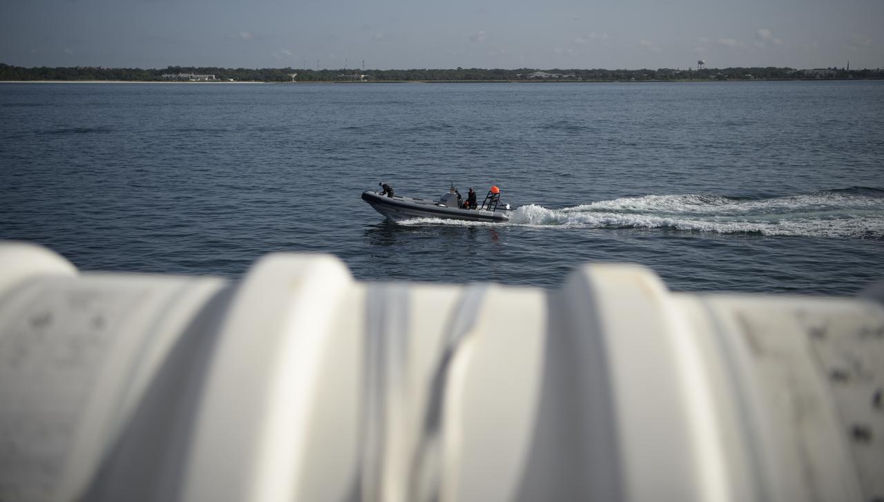 SpaceX support teams are deployed on fast boats from the SpaceX GO Navigator recovery ship ahead of the landing of the SpaceX Crew Dragon Endeavour spacecraft with NASA astronauts Robert Behnken and Douglas Hurley onboard, Sunday, Aug. 2, 2020 in the Gulf of Mexico off the cost of Pensacola, Florida. The Demo-2 test flight for NASA's Commercial Crew Program is the first to deliver astronauts to the International Space Station and return them to Earth onboard a commercially built and operated spacecraft. Behnken and Hurley are returning after spending 64 days in space. Photo Credit: (NASA/Bill Ingalls)