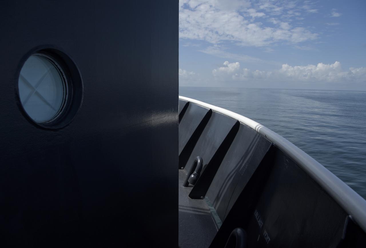 NASA and SpaceX support teams onboard the SpaceX GO Navigator recovery ship prepare for the landing of the SpaceX Crew Dragon Endeavour spacecraft with NASA astronauts Robert Behnken and Douglas Hurley onboard, Sunday, Aug. 2, 2020 in the Gulf of Mexico off the cost of Pensacola, Florida. The Demo-2 test flight for NASA's Commercial Crew Program is the first to deliver astronauts to the International Space Station and return them to Earth onboard a commercially built and operated spacecraft. Behnken and Hurley are returning after spending 64 days in space. Photo Credit: (NASA/Bill Ingalls)