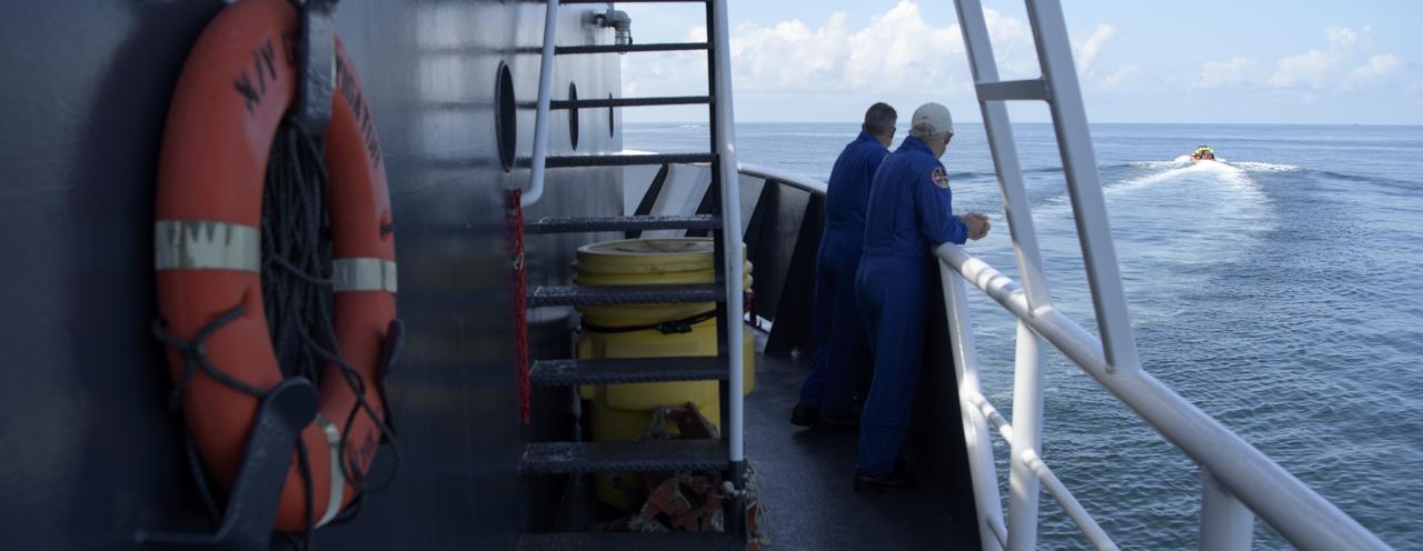NASA and SpaceX support teams onboard the SpaceX GO Navigator recovery ship prepare for the landing of the SpaceX Crew Dragon Endeavour spacecraft with NASA astronauts Robert Behnken and Douglas Hurley onboard, Sunday, Aug. 2, 2020 in the Gulf of Mexico off the cost of Pensacola, Florida. The Demo-2 test flight for NASA's Commercial Crew Program is the first to deliver astronauts to the International Space Station and return them to Earth onboard a commercially built and operated spacecraft. Behnken and Hurley are returning after spending 64 days in space. Photo Credit: (NASA/Bill Ingalls)