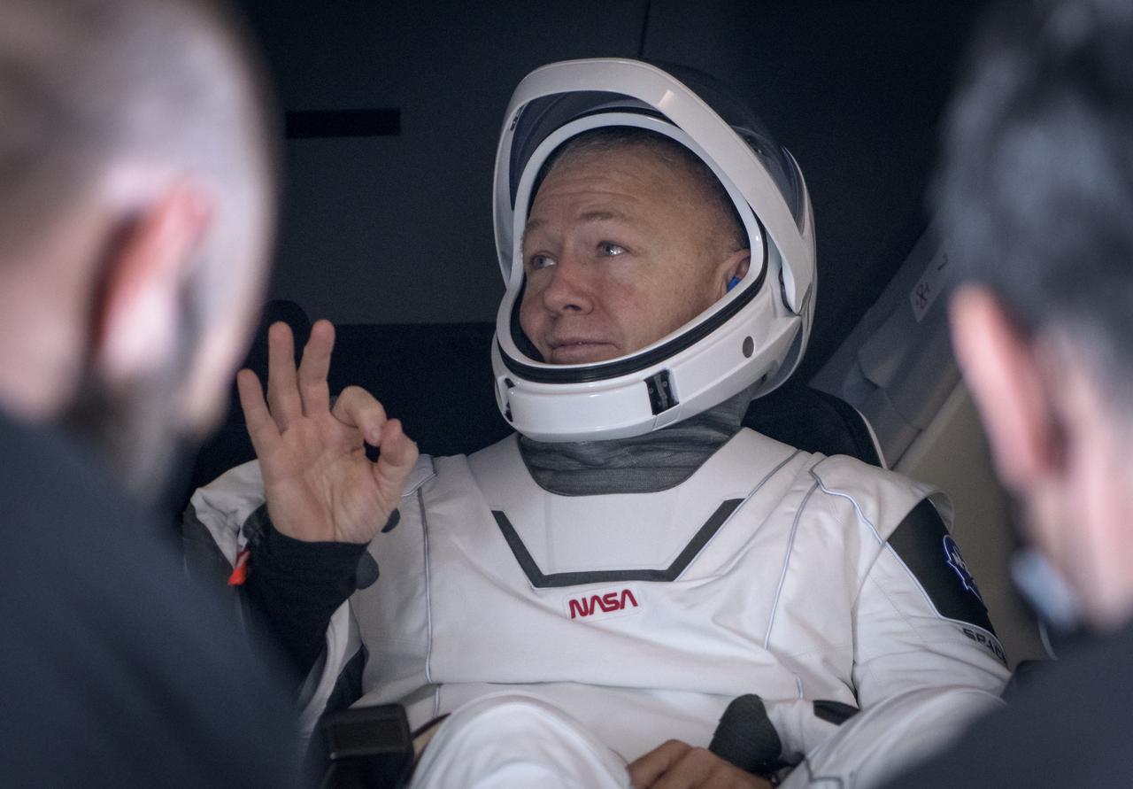 NASA astronaut Douglas Hurley gives the OK sign prior to being helped out of the SpaceX Crew Dragon Endeavour spacecraft onboard the SpaceX GO Navigator recovery ship after he and NASA astronaut Robert Behnken landed in the Gulf of Mexico off the coast of Pensacola, Florida, Sunday, Aug. 2, 2020. The Demo-2 test flight for NASA's Commercial Crew Program was the first to deliver astronauts to the International Space Station and return them safely to Earth onboard a commercially built and operated spacecraft. Behnken and Hurley returned after spending 64 days in space. Photo Credit: (NASA/Bill Ingalls)