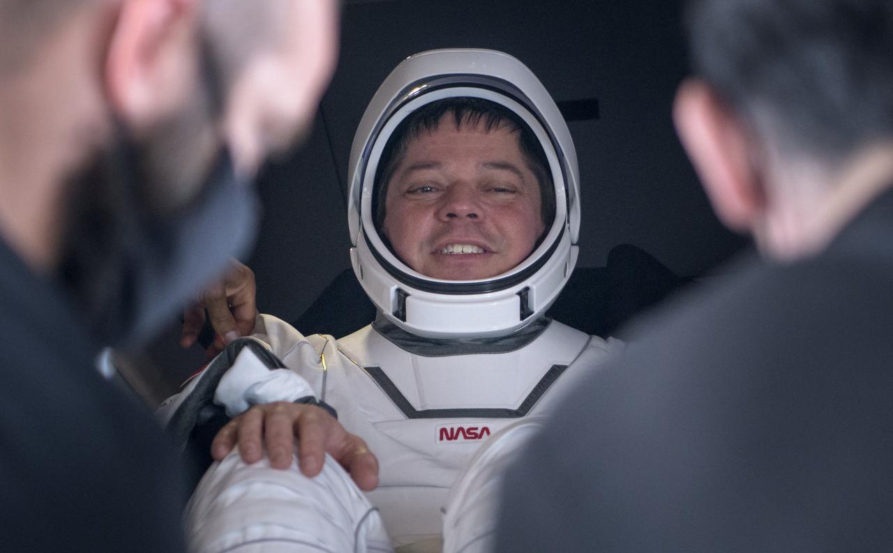 NASA astronaut Robert Behnken smiles prior to being helped out of the SpaceX Crew Dragon Endeavour spacecraft onboard the SpaceX GO Navigator recovery ship after he and NASA astronaut Douglas Hurley landed in the Gulf of Mexico off the coast of Pensacola, Florida, Sunday, Aug. 2, 2020. The Demo-2 test flight for NASA's Commercial Crew Program was the first to deliver astronauts to the International Space Station and return them safely to Earth onboard a commercially built and operated spacecraft. Behnken and Hurley returned after spending 64 days in space. Photo Credit: (NASA/Bill Ingalls)