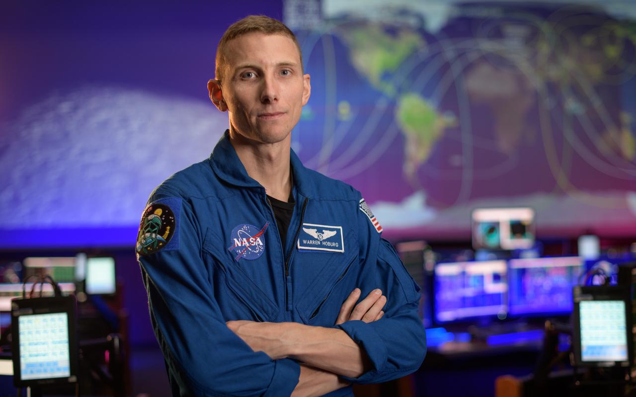 NASA astronaut Warren Hoburg poses for a portrait, Thursday, Sept. 17, 2020, in the Blue Flight Control Room at NASA’s Johnson Space Center in Houston. Photo Credit: (NASA/Bill Ingalls)