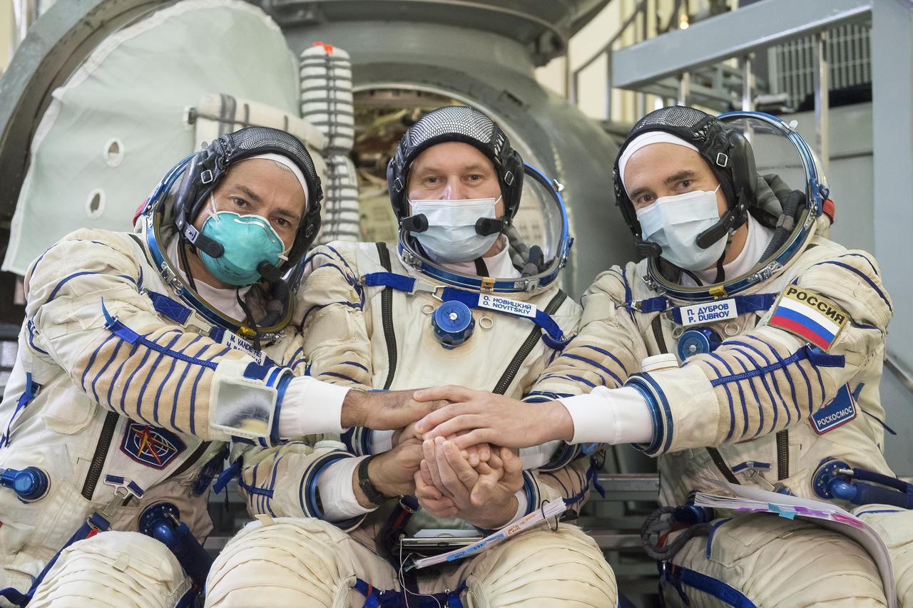 Expedition 64 backup crew members NASA astronaut Mark Vande Hei, left, Russian cosmonaut Oleg Novitskiy of Roscosmos, center, and Russian cosmonaut Petr Dubrov of Roscosmos pose for a photo during qualification exams Tuesday, Sept. 22, 2020 at the Gagarin Cosmonaut Training Center (GCTC) in Star City, Russia. Photo Credit: (NASA/GCTC/Andrey Shelepin)