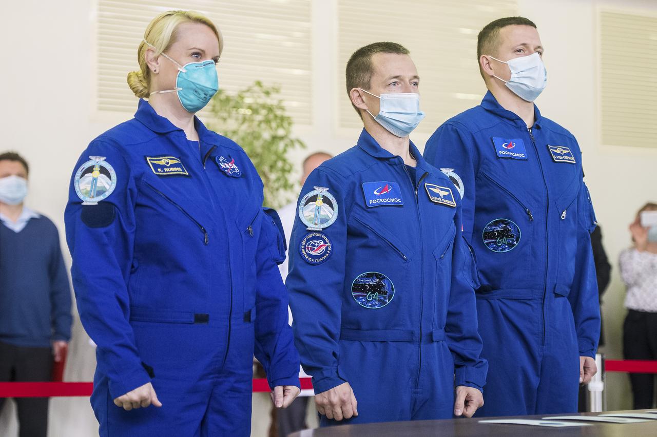 Expedition 64 crew members NASA astronaut Kate Rubins, left, Russian cosmonaut Sergey Ryzhikov of Roscosmos, center, and Russian cosmonaut Sergey Kud-Sverchkov of Roscosmos arrive for Soyuz qualification exams Tuesday, Sept. 22, 2020 at the Gagarin Cosmonaut Training Center (GCTC) in Star City, Russia, in advance of their scheduled launch October 14 from Baikonur Cosmodrome in Kazakhstan to the International Space Station. Photo Credit: (NASA/GCTC/Andrey Shelepin)