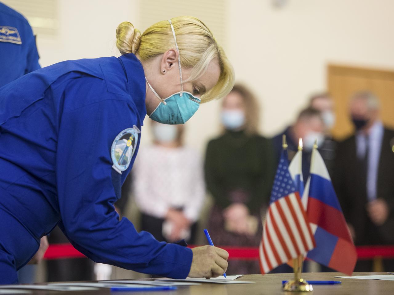 Expedition 64 crew member NASA astronaut Kate Rubins, signs in for Soyuz qualification exams Tuesday, Sept. 22, 2020 at the Gagarin Cosmonaut Training Center (GCTC) in Star City, Russia, in advance of her scheduled launch October 14 from Baikonur Cosmodrome in Kazakhstan to the International Space Station. Photo Credit: (NASA/GCTC/Andrey Shelepin)