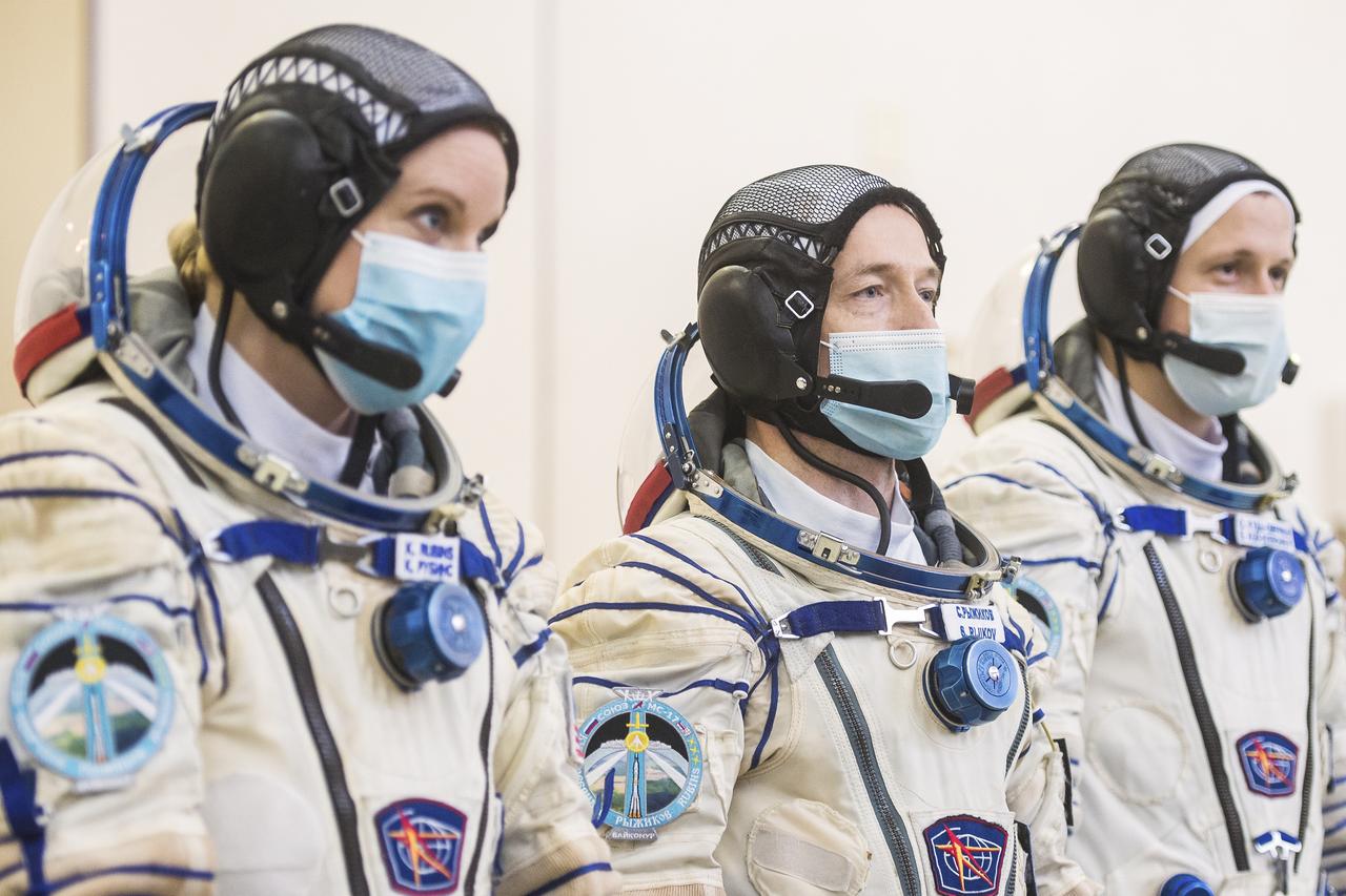 Expedition 64 crew members NASA astronaut Kate Rubins, left, Russian cosmonaut Sergey Ryzhikov of Roscosmos, center, and Russian cosmonaut Sergey Kud-Sverchkov of Roscosmos arrive for Soyuz qualification exams Wednesday, Sept. 23, 2020 at the Gagarin Cosmonaut Training Center (GCTC) in Star City, Russia, in advance of their scheduled launch October 14 from Baikonur Cosmodrome in Kazakhstan to the International Space Station. Photo Credit: (NASA/GCTC/Andrey Shelepin)