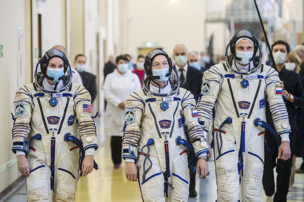 Expedition 64 crew members NASA astronaut Kate Rubins, left, Russian cosmonaut Sergey Ryzhikov of Roscosmos, center, and Russian cosmonaut Sergey Kud-Sverchkov of Roscosmos arrive for Soyuz qualification exams Wednesday, Sept. 23, 2020 at the Gagarin Cosmonaut Training Center (GCTC) in Star City, Russia, in advance of their scheduled launch October 14 from Baikonur Cosmodrome in Kazakhstan to the International Space Station. Photo Credit: (NASA/GCTC/Andrey Shelepin)