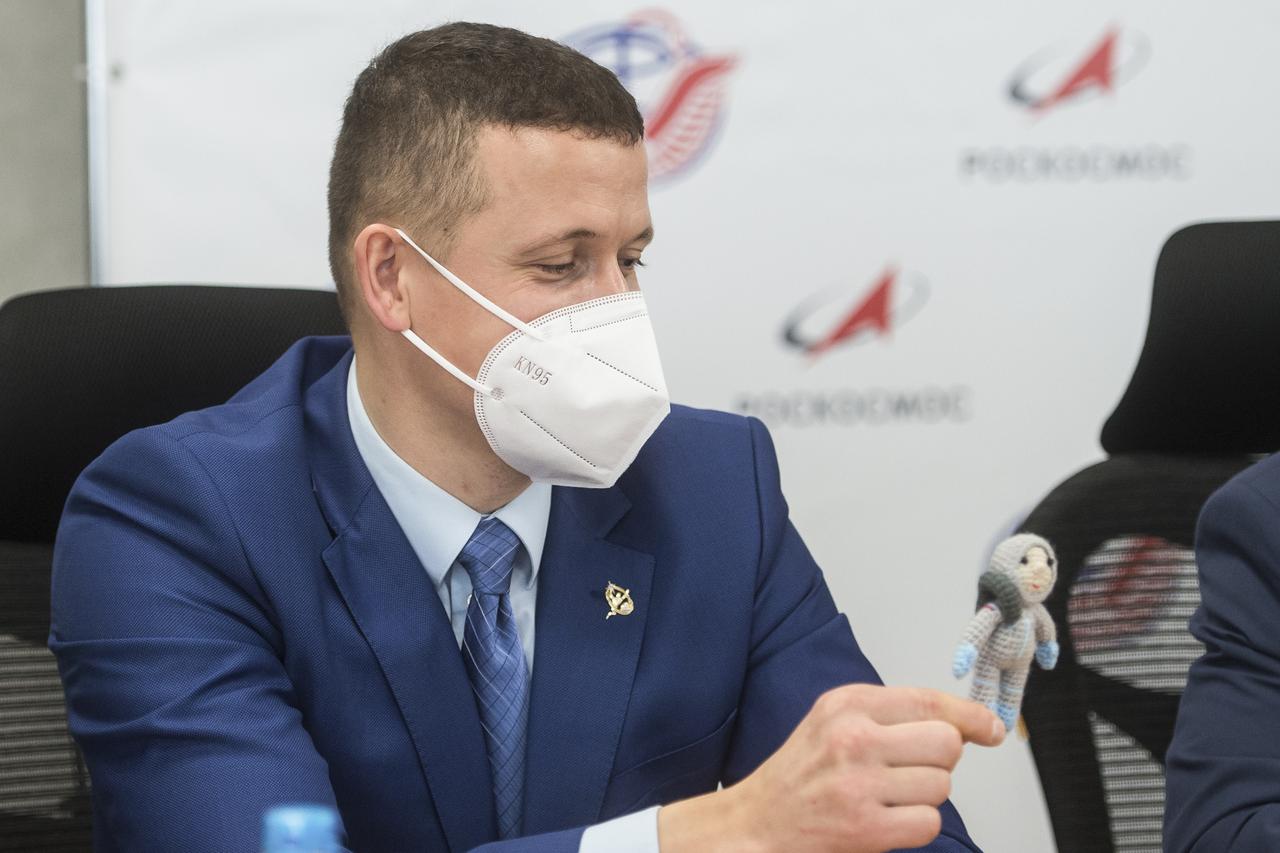 Expedition 64 prime crew member Sergey Kud-Sverchkov holds up a knitted cosmonaut named Yuri that was made by his wife during a press conference prior to his launch from the Baikonur Cosmodrome in Kazakhstan, Thursday, Sept. 24, 2020 at the Gagarin Cosmonaut Training Center (GCTC) in Star City, Russia. Photo Credit: (NASA/GCTC/Andrey Shelepin)