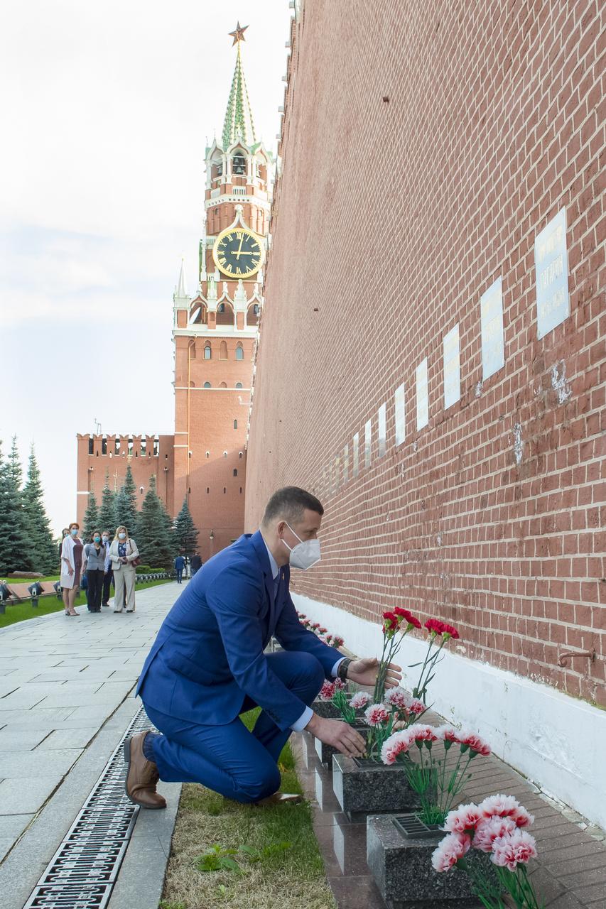 Expedition 64 prime crew member Sergey Kud-Sverchkov of Roscosmos lays flowers at the site where Russian space icons are interred as part of traditional pre-launch ceremonies, Thursday, Sept. 24, 2020 at Red Square in Moscow. Photo Credit: (NASA/GCTC/Irina Spector)