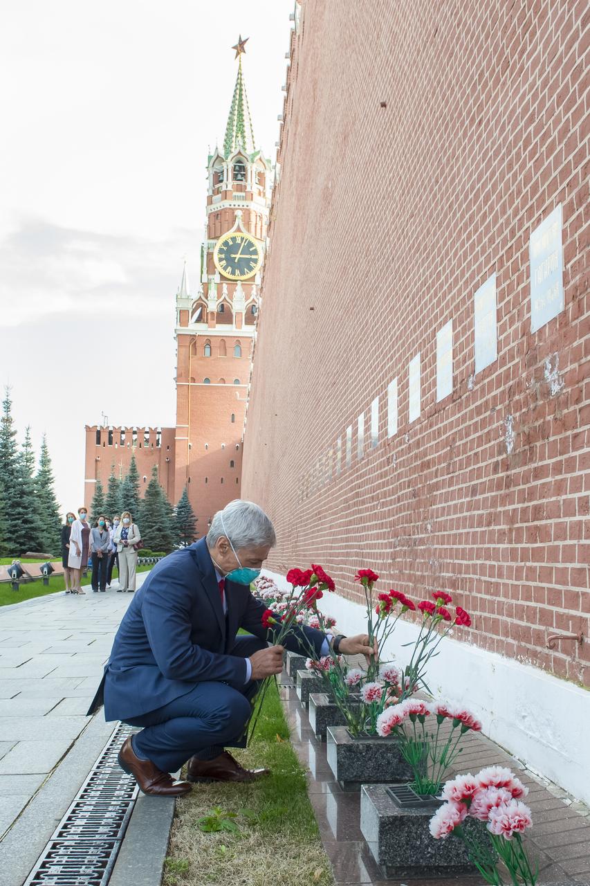 Expedition 64 backup crew member, Mark Vande Hei of NASA lays flowers at the site where Russian space icons are interred as part of traditional pre-launch ceremonies, Thursday, Sept. 24, 2020 at Red Square in Moscow. Photo Credit: (NASA/GCTC/Irina Spector)