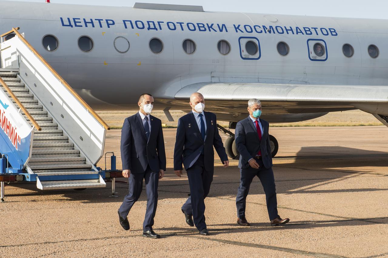 Expedition 64 backup crew members Russian cosmonaut Petr Dubrov of Roscosmos, left, Russian cosmonaut Oleg Novitskiy of Roscosmos, center, and NASA astronaut Mark Vande Hei, arrive in Baikonur, Kazakhstan from the Gagarin Cosmonaut Training Center, Sunday, Sept. 27, 2020. The prime crew is scheduled to launch from the Baikonur Cosmosdrome on a Soyuz rocket October 14. Photo Credit: (NASA/GCTC/Andrey Shelepin)