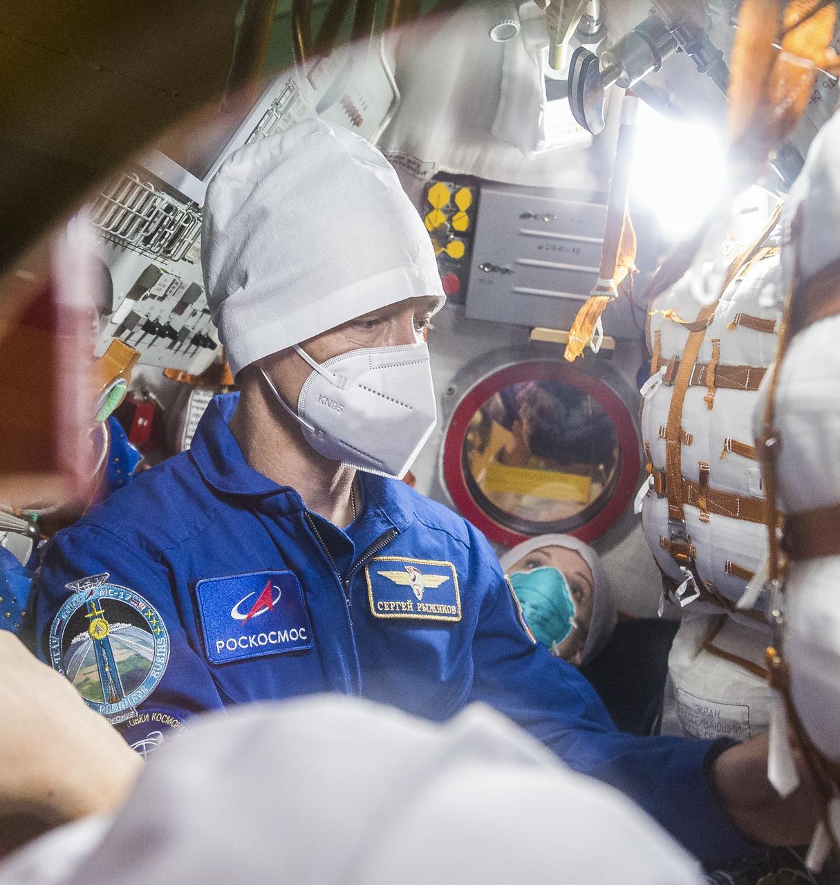 Expedition 64 NASA astronaut Kate Rubins, back, and Russian cosmonauts Sergey Ryzhikov, middle, and Sergey Kud-Sverchkov of Roscosmos are seen inside the Soyuz MS-17 spacecraft during a fit check, Monday, Sept. 28, 2020, at the Baikonur Cosmodrome in Kazakhstan. The trio are preparing for launch to the International Space Station in their Soyuz MS-17 spacecraft from the Baikonur Cosmodrome in Kazakhstan on October 14, Baikonur time. Photo Credit: (NASA/GCTC/Andrey Shelepin)