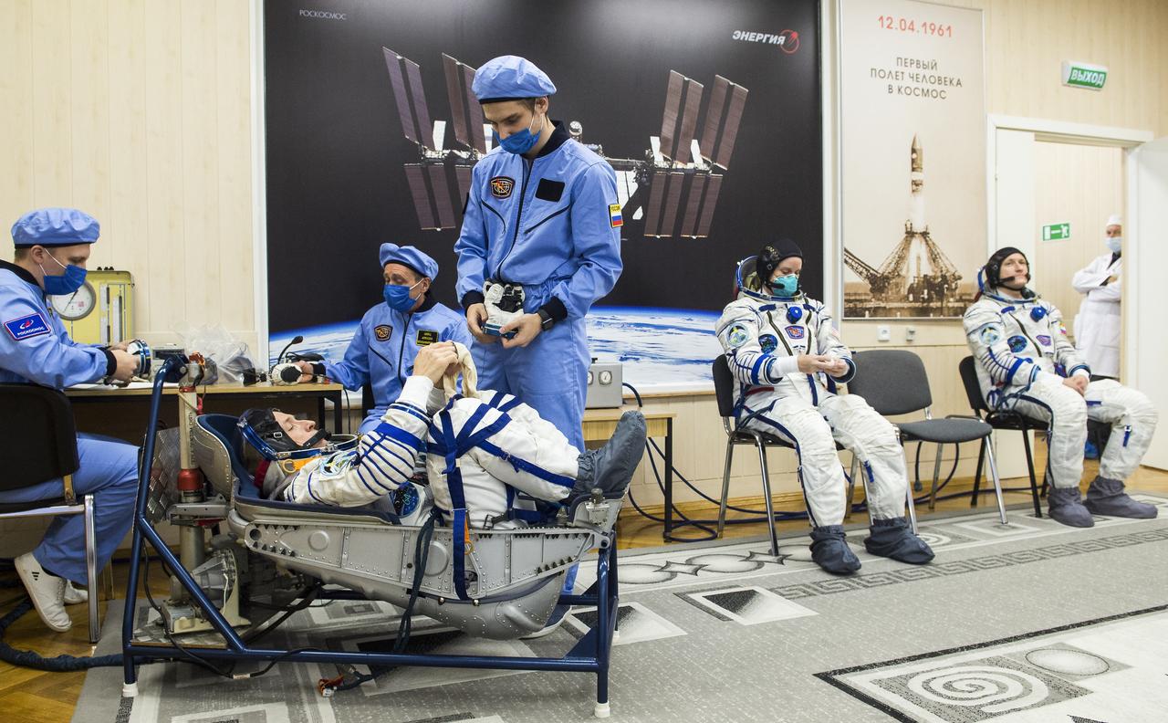 Expedition 64 Russian cosmonaut Sergey Ryzhikov of Roscosmos is seen while having his Sokol suit pressure checked during the Soyuz MS-17 spacecraft fit check, Monday, Sept. 28, 2020, at the Baikonur Cosmodrome in Kazakhstan. Ryzhikov, NASA astronaut Kate Rubins, and Russian cosmonaut Sergey Kud-Sverchkov of Roscosmos are preparing for launch to the International Space Station in their Soyuz MS-17 spacecraft from the Baikonur Cosmodrome in Kazakhstan on October 14, Baikonur time. Photo Credit: (NASA/GCTC/Andrey Shelepin)