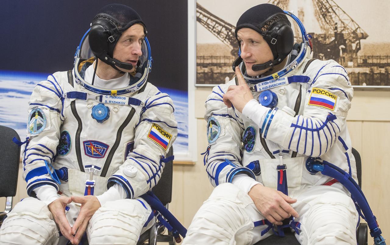 Expedition 64 Russian cosmonauts Sergey Ryzhikov, left, and Sergey Kud-Sverchkov, right, of Roscosmos are seen during pressure checks of their Sokol suits during the Soyuz MS-17 spacecraft fit check, Monday, Sept. 28, 2020, at the Baikonur Cosmodrome in Kazakhstan. Ryzhikov, Kud-Sverchkov, and NASA astronaut Kate Rubins are preparing for launch to the International Space Station in their Soyuz MS-17 spacecraft from the Baikonur Cosmodrome in Kazakhstan on October 14, Baikonur time. Photo Credit: (NASA/GCTC/Andrey Shelepin)