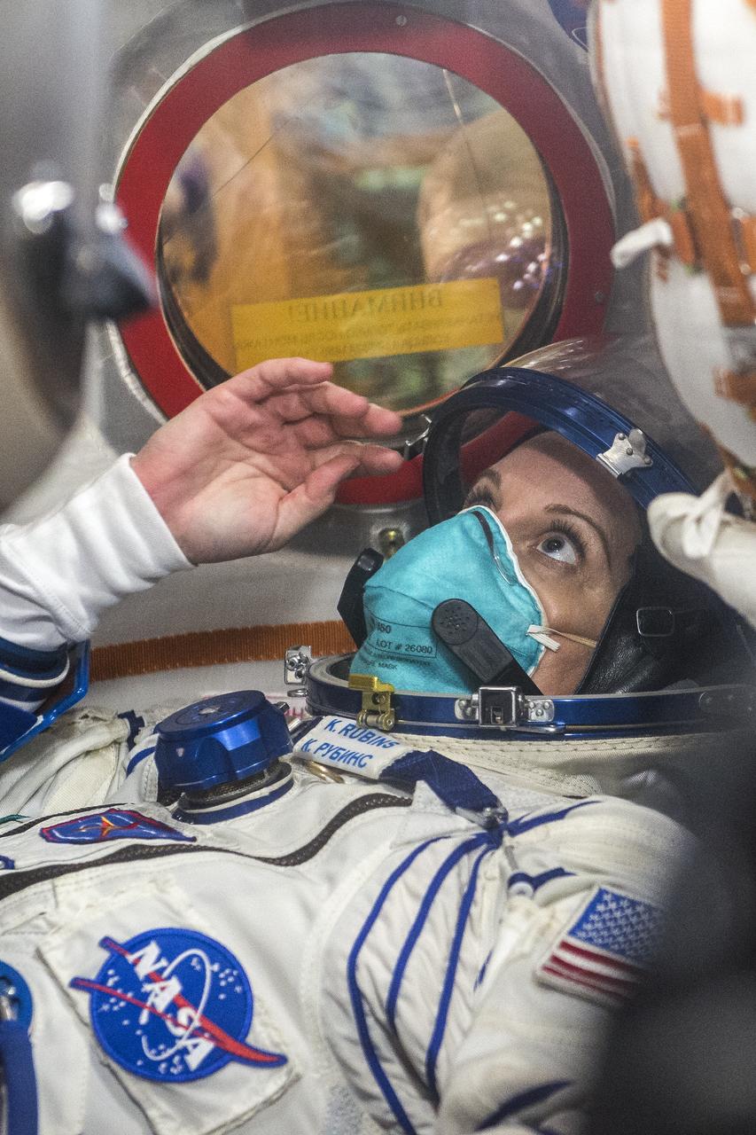 Expedition 64 NASA astronaut Kate Rubins is seen inside the Soyuz MS-17 spacecraft during the fit check to with Russian cosmonauts Sergey Ryzhikov and Sergey Kud-Sverchkov of Roscosmos, Monday, Sept. 28, 2020, Baikonur Cosmodrome in Kazakhstan. The trio are preparing for launch to the International Space Station in their Soyuz MS-17 spacecraft from the Baikonur Cosmodrome in Kazakhstan on October 14, Baikonur time. Photo Credit: (NASA/GCTC/Andrey Shelepin)