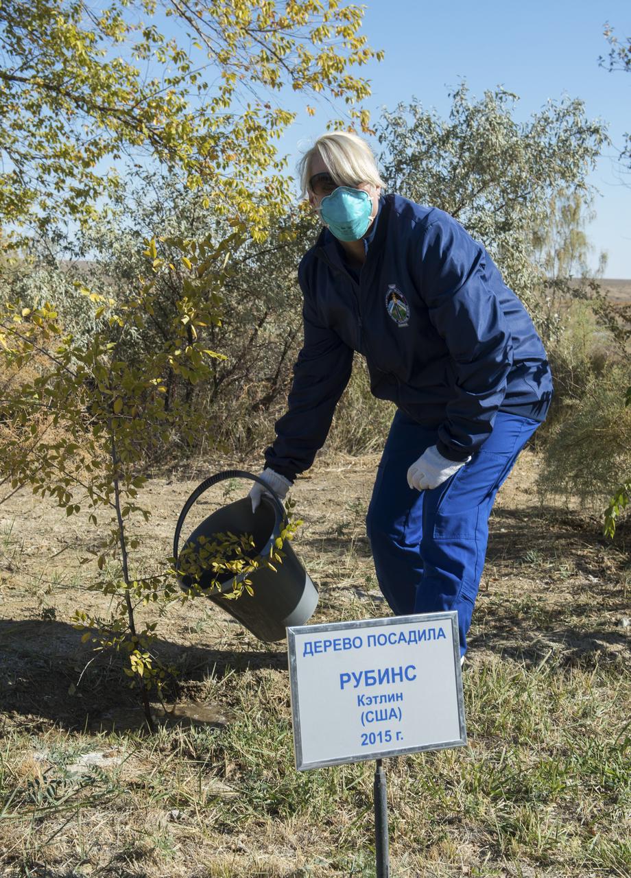 Expedition 64 NASA astronaut Kate Rubins waters a tree bearing her name as part of traditional pre-launch activities, Tuesday, Oct. 6, 2020, at the Cosmonaut Hotel in Baikonur, Kazakhstan. Rubins, along with Sergey Ryzhikov and Sergey Kud-Sverchkov of Roscosmos, are scheduled to launch to the International Space Station aboard the Soyuz MS-17 spacecraft on October 14. Photo Credit: (NASA/GCTC/Andrey Shelepin)