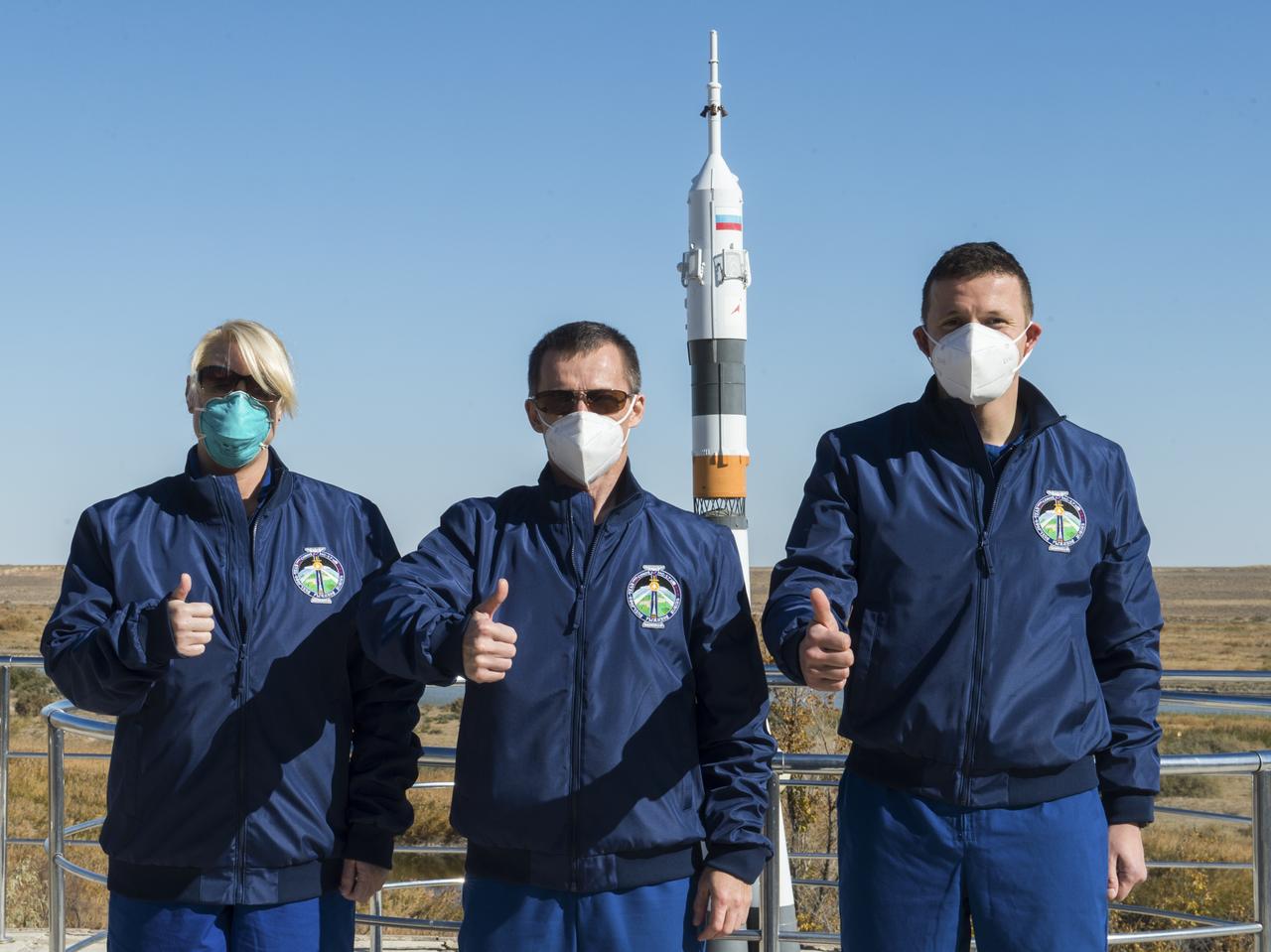 Expedition 64 crew members NASA astronaut Kate Rubins, left, and Russian cosmonauts Sergey Ryzhikov, center, and Sergey Kud-Sverchkov of Roscosmos, right, pose for a picture as part of pre-launch activities, Tuesday, Oct. 6, 2020, at the Cosmonaut Hotel in Baikonur, Kazakhstan. The trio are scheduled to launch to the International Space Station aboard the Soyuz MS-17 spacecraft on October 14. Photo Credit: (NASA/GCTC/Andrey Shelepin)