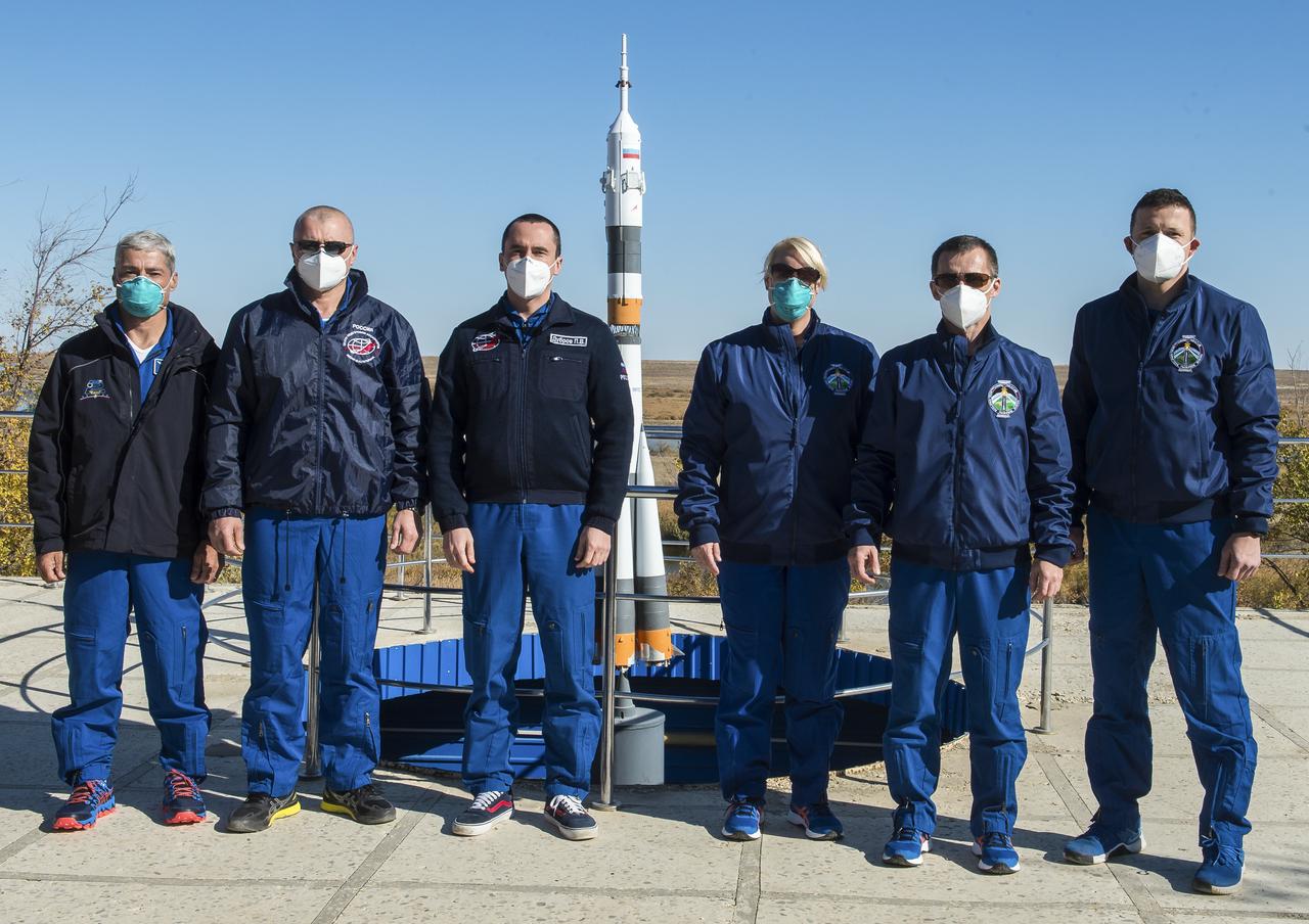 Expedition 64 backup and prime crew members pose for a picture as part of pre-launch activities, Tuesday, Oct. 6, 2020, at the Cosmonaut Hotel in Baikonur, Kazakhstan. From left to right are backup crew members Mark Vande Hei of NASA, Oleg Novitskiy of Roscosmos, Petr Dubrov of Roscosmos, and prime crew members Kate Rubins of NASA, Sergey Ryzhikov of Roscosmos, and Sergey Kud-Sverchkov of Roscosmos. Expedition 64 prime crew members Ryzhikov, Kud-Sverchkov, and Rubins are scheduled to launch to the International Space Station aboard the Soyuz MS-17 spacecraft on October 14. Photo Credit: (NASA/GCTC/Andrey Shelepin)