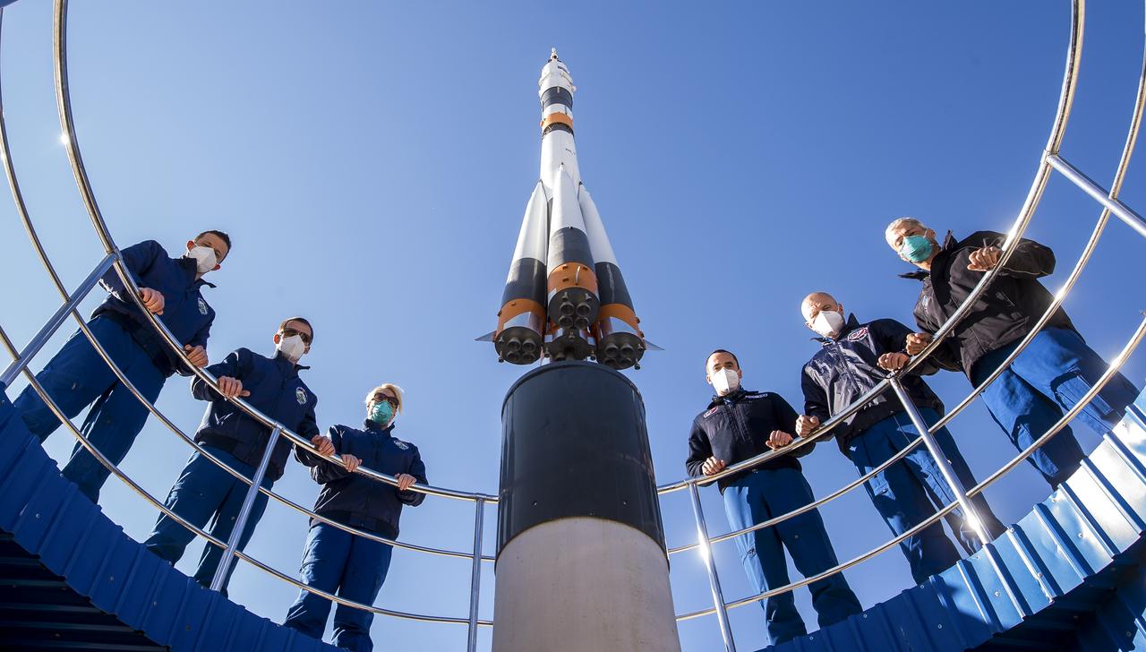 Expedition 64 prime and backup crew members pose for a picture as part of pre-launch activities, Tuesday, Oct. 6, 2020, at the Cosmonaut Hotel in Baikonur, Kazakhstan. From left to right are prime crew members Sergey Kud-Sverchkov of Roscosmos, Sergey Ryzhikov of Roscosmos, and Kate Rubins of NASA, and backup crew members Petr Dubrov of Roscosmos, Oleg Novitskiy of Roscosmos, and Mark Vande Hei of NASA. Expedition 64 prime crew members Ryzhikov, Kud-Sverchkov, and Rubins are scheduled to launch to the International Space Station aboard the Soyuz MS-17 spacecraft on October 14. Photo Credit: (NASA/GCTC/Andrey Shelepin)