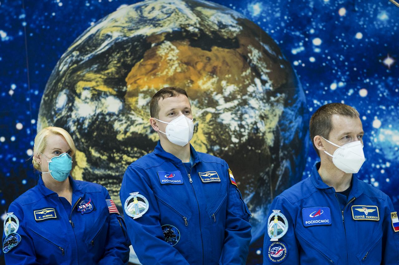 Expedition 64 NASA astronaut Kate Rubins, left, and Russian cosmonauts Sergey Kud-Sverchkov, center, and Sergey Ryzhikov of Roscosmos, right, are seen during a traditional tour of the Baikonur Cosmodrome Museum, Wednesday, Oct. 7, 2020, Baikonur Cosmodrome in Kazakhstan. The trio are scheduled to launch to the International Space Station aboard the Soyuz MS-17 spacecraft on October 14. Photo Credit: (NASA/GCTC/Andrey Shelepin)