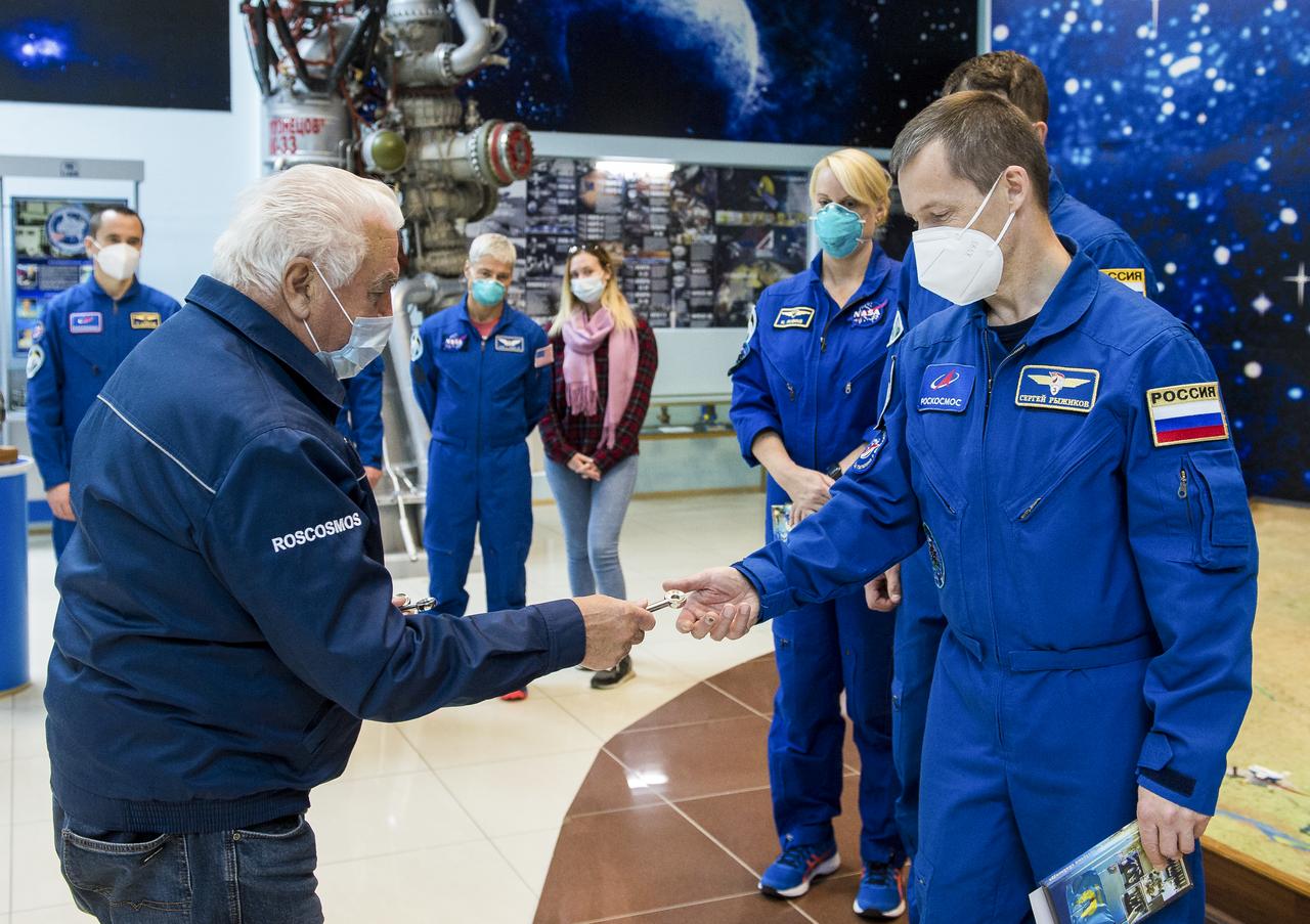 Expedition 64 Russian cosmonaut Sergey Ryzhikov of Roscosmos is presented with a souvenir launch key during traditional pre-launch ceremonies at the Baikonur Cosmodrome Museum, Wednesday, Oct. 7, 2020, at the Baikonur Cosmodrome in Kazakhstan. Ryzhikov, Sergey Kud-Sverchkov of Roscosmos, and Kate Rubins of NASA are scheduled to launch to the International Space Station aboard the Soyuz MS-17 spacecraft on October 14. Photo Credit: (NASA/GCTC/Andrey Shelepin)