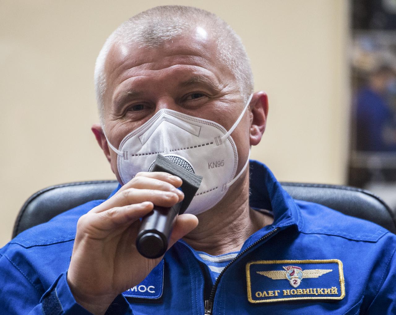 Expedition 64 backup crew member Oleg Novitskiy of Roscosmos is seen in quarantine, behind glass, during a press conference, Tuesday, Oct. 13, 2020, at the Cosmonaut Hotel in Baikonur, Kazakhstan. Expedition 64 prime crew members Kate Rubins of NASA, and Sergey Ryzhikov and Sergey Kud-Sverchkov of Roscosmos are scheduled to launch to the International Space Station aboard the Soyuz MS-17 spacecraft on October 14. Photo Credit: (NASA/GCTC/Andrey Shelepin)