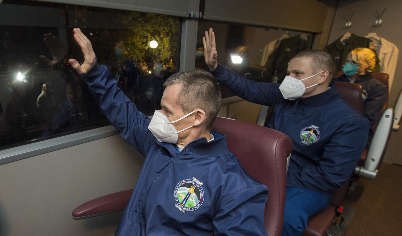 Expedition 64 Russian cosmonauts Sergey Ryzhikov, left, and Sergey Kud-Sverchkov, center, of Roscosmos, and NASA astronaut Kate Rubins, left, are seen as they depart the Cosmonaut Hotel to suit-up for their Soyuz launch to the International Space Station, Wednesday, Oct. 14, 2020, in Baikonur, Kazakhstan. Launch of the Soyuz MS-17 spacecraft with Ryzhikov, Kud-Sverchkov, Rubins occurred at 1:45 a.m. EDT to begin their six-month mission onboard the International Space Station. Photo Credit: (NASA/GCTC/Andrey Shelepin)