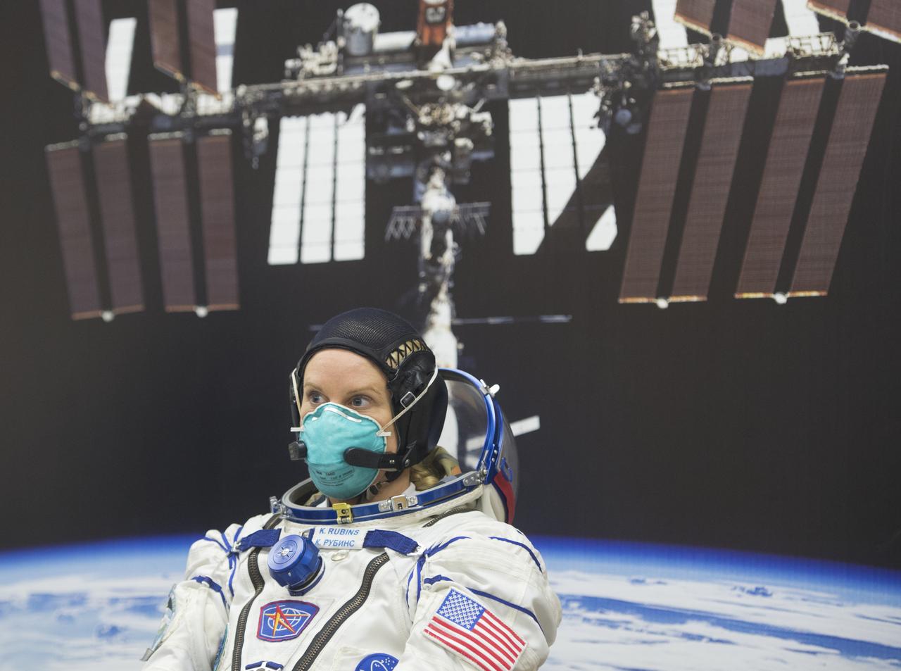 Expedition 64 NASA astronaut Kate Rubins is seen as she waits to have her Russian Sokol suit pressure checked as she and fellow crewmates Sergey Kud-Sverchkov and Sergey Ryzhikov of Roscosmos prepare for their Soyuz launch to the International Space Station Wednesday, Oct. 14, 2020, at the Baikonur Cosmodrome in Kazakhstan. The trio launched at 1:45 a.m. EDT to begin a six-month mission aboard the International Space Station. Photo Credit: (NASA/GCTC/Andrey Shelepin)