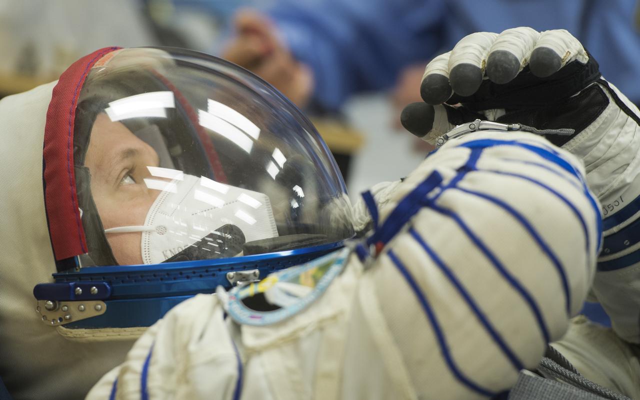 Expedition 64 Russian cosmonaut Sergey Kud-Sverchkov of Roscosmos is seen as his Russian Sokol suit is pressure checked as he and fellow crewmates Sergey Ryzhikov of Roscosmos and Kate Rubins of NASA prepare for their Soyuz launch to the International Space Station Wednesday, Oct. 14, 2020, at the Baikonur Cosmodrome in Kazakhstan. The trio launched at 1:45 a.m. EDT to begin a six-month mission aboard the International Space Station. Photo Credit: (NASA/GCTC/Andrey Shelepin)
