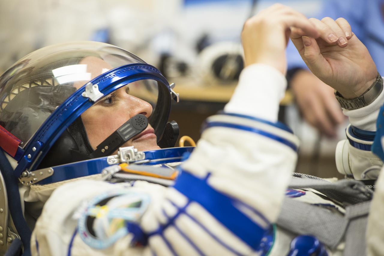 Expedition 64 NASA astronaut Kate Rubins is seen as she prepares to have her Russian Sokol suit pressure checked as she and fellow crewmates Sergey Kud-Sverchkov and Sergey Ryzhikov of Roscosmos prepare for their Soyuz launch to the International Space Station Wednesday, Oct. 14, 2020, at the Baikonur Cosmodrome in Kazakhstan. The trio launched at 1:45 a.m. EDT to begin a six-month mission aboard the International Space Station. Photo Credit: (NASA/GCTC/Andrey Shelepin)
