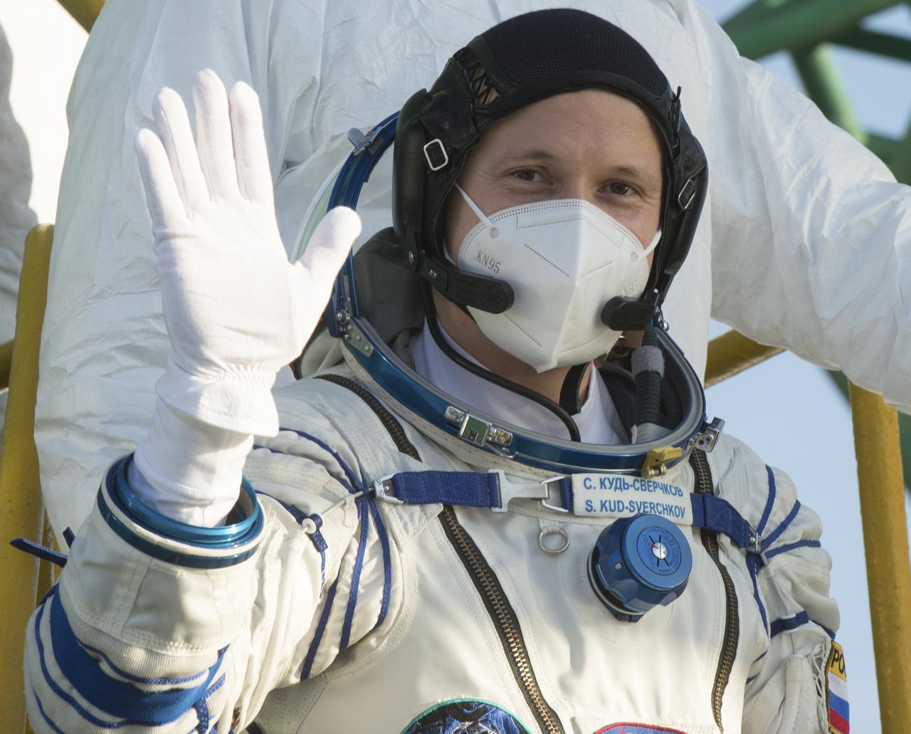 Expedition 64 Russian cosmonaut Sergey Kud-Sverchkov of Roscosmos, waves farewell prior to boarding the Soyuz MS-17 spacecraft for launch with fellow crewmates Sergey Ryzhikov of Roscosmos and Kate Rubins of NASA, Wednesday, Oct. 14, 2020, at the Baikonur Cosmodrome in Kazakhstan. The trio launched at 1:45 a.m. EDT to begin a two-orbit, three-hour flight to reach the International Space Station. Photo Credit: (NASA/GCTC/Andrey Shelepin)