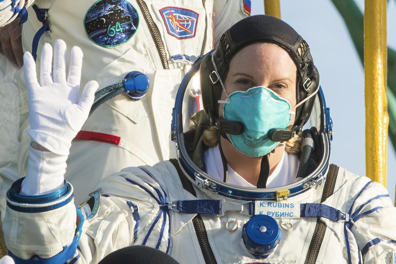 Expedition 64 NASA astronaut Kate Rubins, waves farewell prior to boarding the Soyuz MS-17 spacecraft for launch with fellow crewmates Sergey Ryzhikov and Sergey Kud-Sverchkov of Roscosmos, Wednesday, Oct. 14, 2020, at the Baikonur Cosmodrome in Kazakhstan. The trio launched at 1:45 a.m. EDT to begin a two-orbit, three-hour flight to reach the International Space Station. Photo Credit: (NASA/GCTC/Andrey Shelepin)