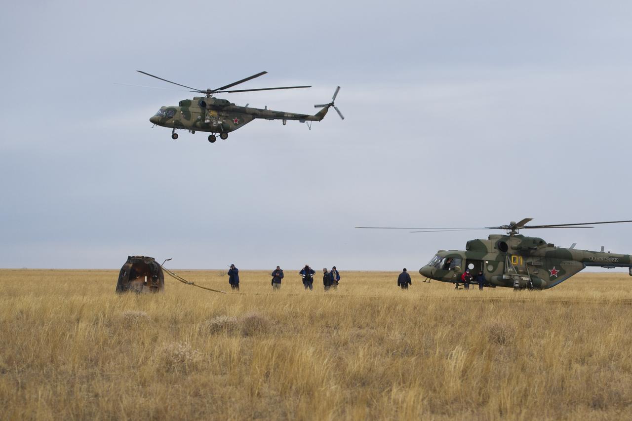 Russian Search and Rescue teams arrive at the Soyuz MS-16 spacecraft shortly after it landed in a remote area near the town of Zhezkazgan, Kazakhstan with Expedition 63 crew members Chris Cassidy of NASA, Anatoly Ivanishin and Ivan Vagner of Roscosmos, Thursday, October 22, 2020, Kazakh time (Oct. 21 Eastern time). Cassidy, Ivanishin and Vagner returned after 196 days in space having served as Expedition 62-63 crew members onboard the International Space Station. Photo Credit: (NASA/GCTC/Denis Derevtsov)