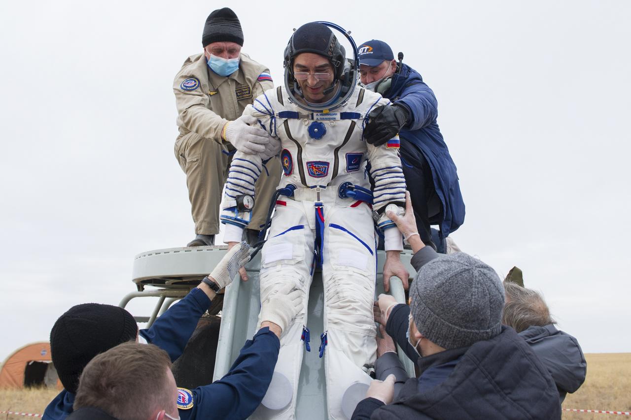 Expedition 63 Roscosmos cosmonaut Anatoly Ivanishin is helped out of the Soyuz MS-16 spacecraft just minutes after he, Roscosmos cosmonaut Ivan Vagner, and NASA astronaut Chris Cassidy, landed in a remote area near the town of Zhezkazgan, Kazakhstan on Thursday, October 22, 2020, Kazakh time (Oct. 21 Eastern time). Cassidy, Ivanishin and Vagner returned after 196 days in space having served as Expedition 62-63 crew members onboard the International Space Station. Photo Credit: (NASA/GCTC/Denis Derevtsov)