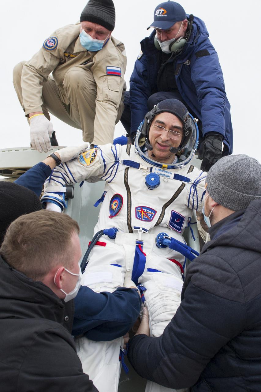 Expedition 63 Roscosmos cosmonaut Anatoly Ivanishin is helped out of the Soyuz MS-16 spacecraft just minutes after he, Roscosmos cosmonaut Ivan Vagner, and NASA astronaut Chris Cassidy, landed in a remote area near the town of Zhezkazgan, Kazakhstan on Thursday, October 22, 2020, Kazakh time (Oct. 21 Eastern time). Cassidy, Ivanishin and Vagner returned after 196 days in space having served as Expedition 62-63 crew members onboard the International Space Station. Photo Credit: (NASA/GCTC/Denis Derevtsov)
