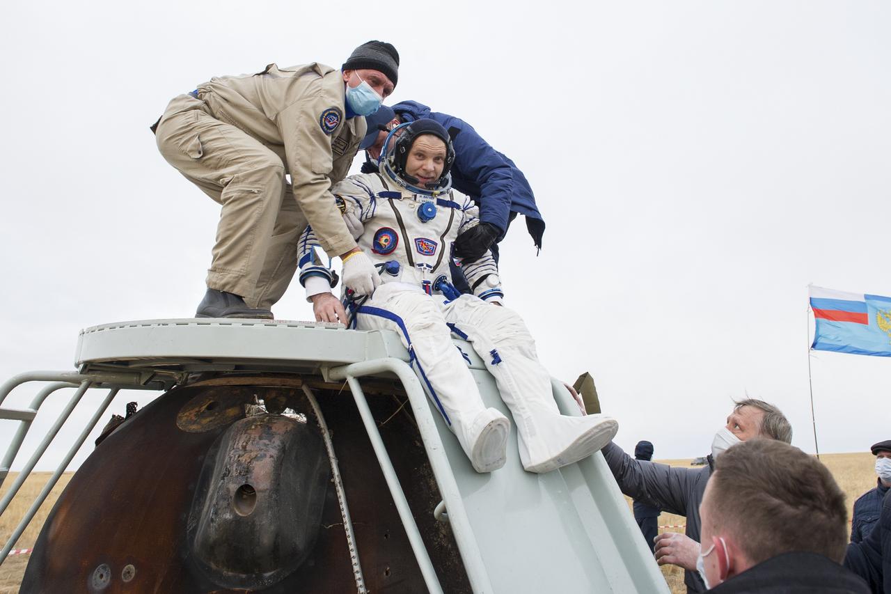 Expedition 63 Roscosmos cosmonaut Ivan Vagner is helped out of the Soyuz MS-16 spacecraft just minutes after he, Roscosmos cosmonaut Anatoly Ivanishin, and NASA astronaut Chris Cassidy, landed in a remote area near the town of Zhezkazgan, Kazakhstan on Thursday, October 22, 2020, Kazakh time (Oct. 21 Eastern time). Cassidy, Ivanishin and Vagner returned after 196 days in space having served as Expedition 62-63 crew members onboard the International Space Station. Photo Credit: (NASA/GCTC/Denis Derevtsov)