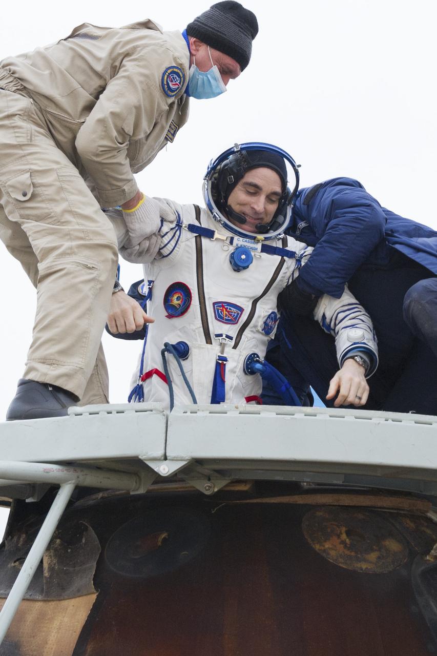 Expedition 63 NASA astronaut Chris Cassidy is helped out of the Soyuz MS-16 spacecraft just minutes after he and Roscosmos cosmonauts Anatoly Ivanishin, and Ivan Vagner, landed in a remote area near the town of Zhezkazgan, Kazakhstan on Thursday, October 22, 2020, Kazakh time (Oct. 21 Eastern time). Cassidy, Ivanishin and Vagner returned after 196 days in space having served as Expedition 62-63 crew members onboard the International Space Station. Photo Credit: (NASA/GCTC/Denis Derevtsov)