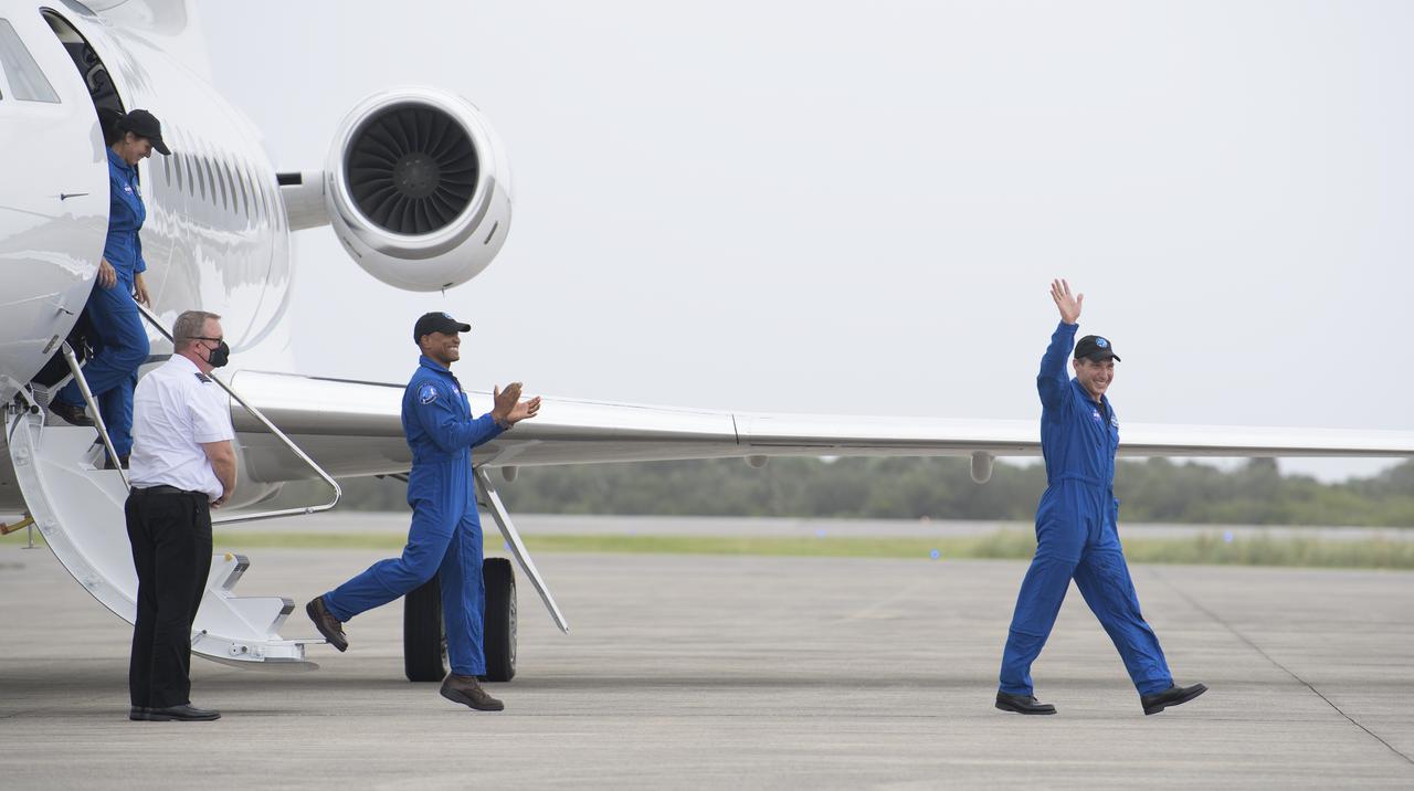 NASA astronauts Mike Hopkins, right, Victor Glover, center, and Shannon Walker, left, are seen as they arrive with Japan Aerospace Exploration Agency (JAXA) astronaut Soichi Noguchi, at the Launch and Landing Facility at NASA’s Kennedy Space Center ahead of SpaceX’s Crew-1 mission, Sunday, Nov. 8, 2020, in Florida. NASA’s SpaceX Crew-1 mission is the first operational mission of the SpaceX Crew Dragon spacecraft and Falcon 9 rocket to the International Space Station as part of the agency’s Commercial Crew Program. NASA astronauts Mike Hopkins, Victor Glover, and Shannon Walker, and astronaut Soichi Noguchi of the Japan Aerospace Exploration Agency (JAXA) are scheduled to launch at 7:49 p.m. EST on Saturday, Nov. 14, from Launch Complex 39A at the Kennedy Space Center. Photo Credit: (NASA/Joel Kowsky)