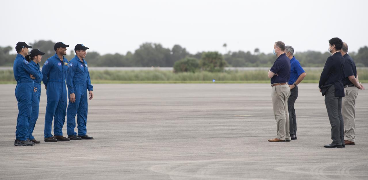 NASA Administrator Jim Bridenstine, NASA Deputy Administrator Jim Morhard, Kennedy Space Center Director Bob Cabana and Junichi Sakai, manager of the International Space Station Program for the Japan Aerospace Exploration Agency (JAXA) greet NASA astronauts Mike Hopkins, Victor Glover, and Shannon Walker, and astronaut Soichi Noguchi of the Japan Aerospace Exploration Agency (JAXA) as they arrive at the Launch and Landing Facility at NASA’s Kennedy Space Center ahead of SpaceX’s Crew-1 mission, Sunday, Nov. 8, 2020, in Florida. NASA’s SpaceX Crew-1 mission is the first operational mission of the SpaceX Crew Dragon spacecraft and Falcon 9 rocket to the International Space Station as part of the agency’s Commercial Crew Program. Hopkins, Glover, Walker, Noguchi are scheduled to launch at 7:49 p.m. EST on Saturday, Nov. 14, from Launch Complex 39A at the Kennedy Space Center. Photo Credit: (NASA/Joel Kowsky)