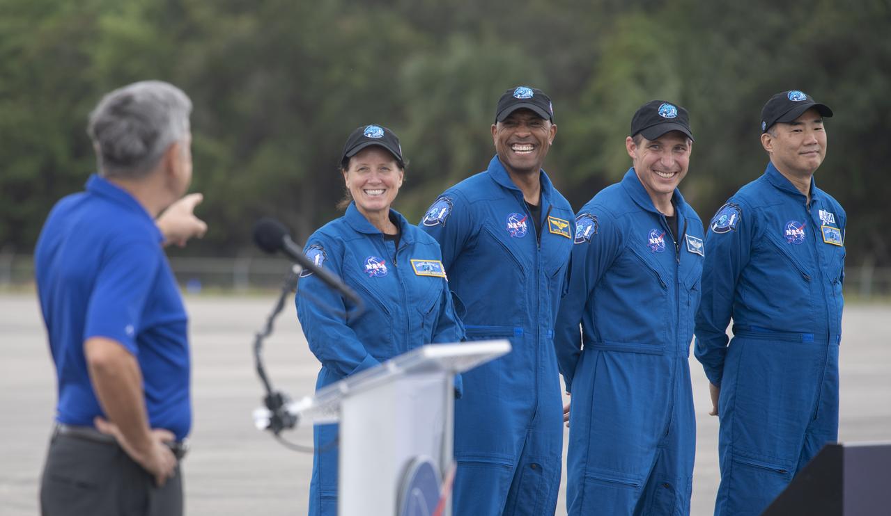 NASA astronauts Shannon Walker, left, Victor Glover, second from left, Mike Hopkins, second from right, and Japan Aerospace Exploration Agency (JAXA) astronaut Soichi Noguchi, right, are introduced by Kennedy Space Center Director Bob Cabana after arriving at the Launch and Landing Facility at NASA’s Kennedy Space Center ahead of SpaceX’s Crew-1 mission, Sunday, Nov. 8, 2020, in Florida. NASA’s SpaceX Crew-1 mission is the first operational mission of the SpaceX Crew Dragon spacecraft and Falcon 9 rocket to the International Space Station as part of the agency’s Commercial Crew Program. Hopkins, Glover, Walker, Noguchi are scheduled to launch at 7:49 p.m. EST on Saturday, Nov. 14, from Launch Complex 39A at the Kennedy Space Center. Photo Credit: (NASA/Joel Kowsky)